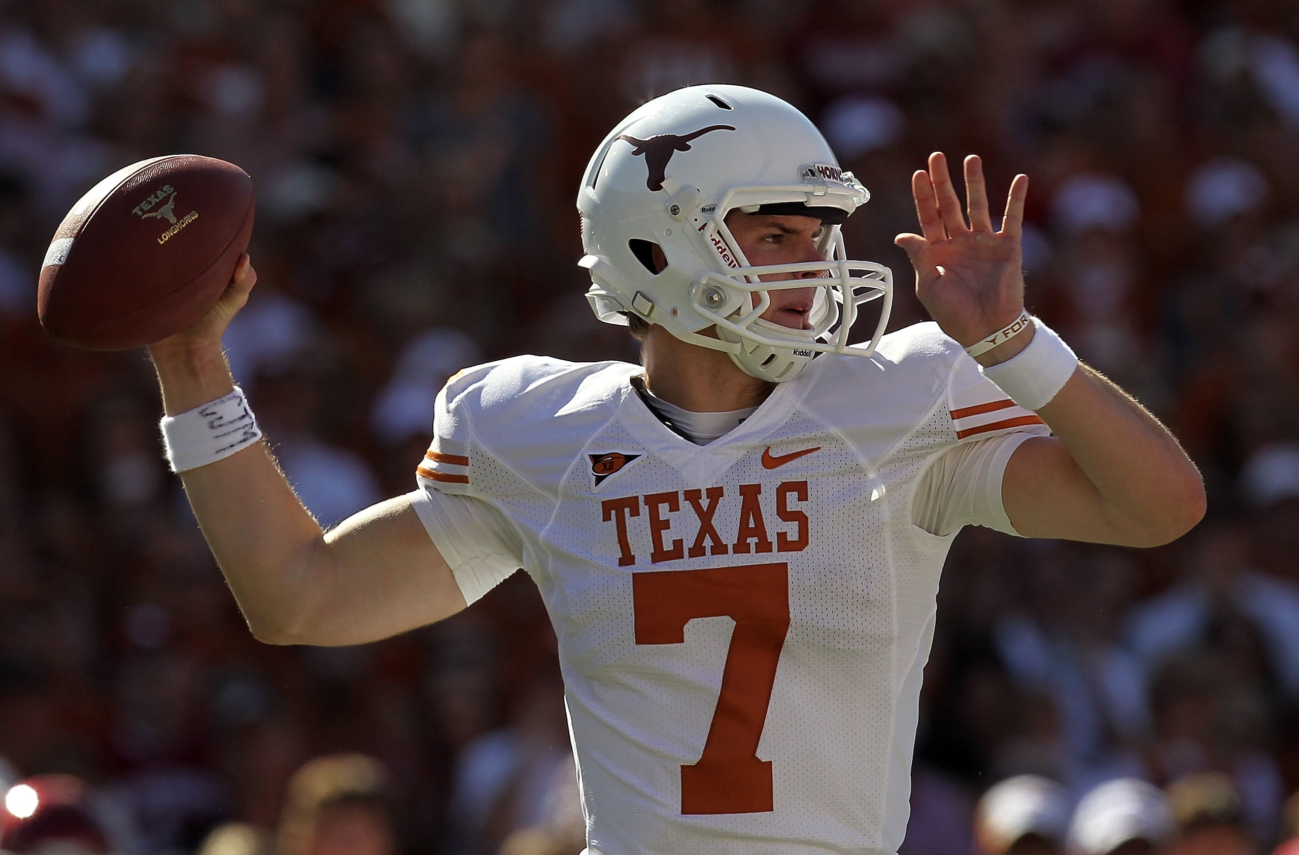 DALLAS - OCTOBER 02:  Quarterback Garrett Gilbert #7 of the Texas Longhorns drops back to pass against the Oklahoma Sooners in the second quarter at the Cotton Bowl on October 2, 2010 in Dallas, Texas.  (Photo by Ronald Martinez/Getty Images)
