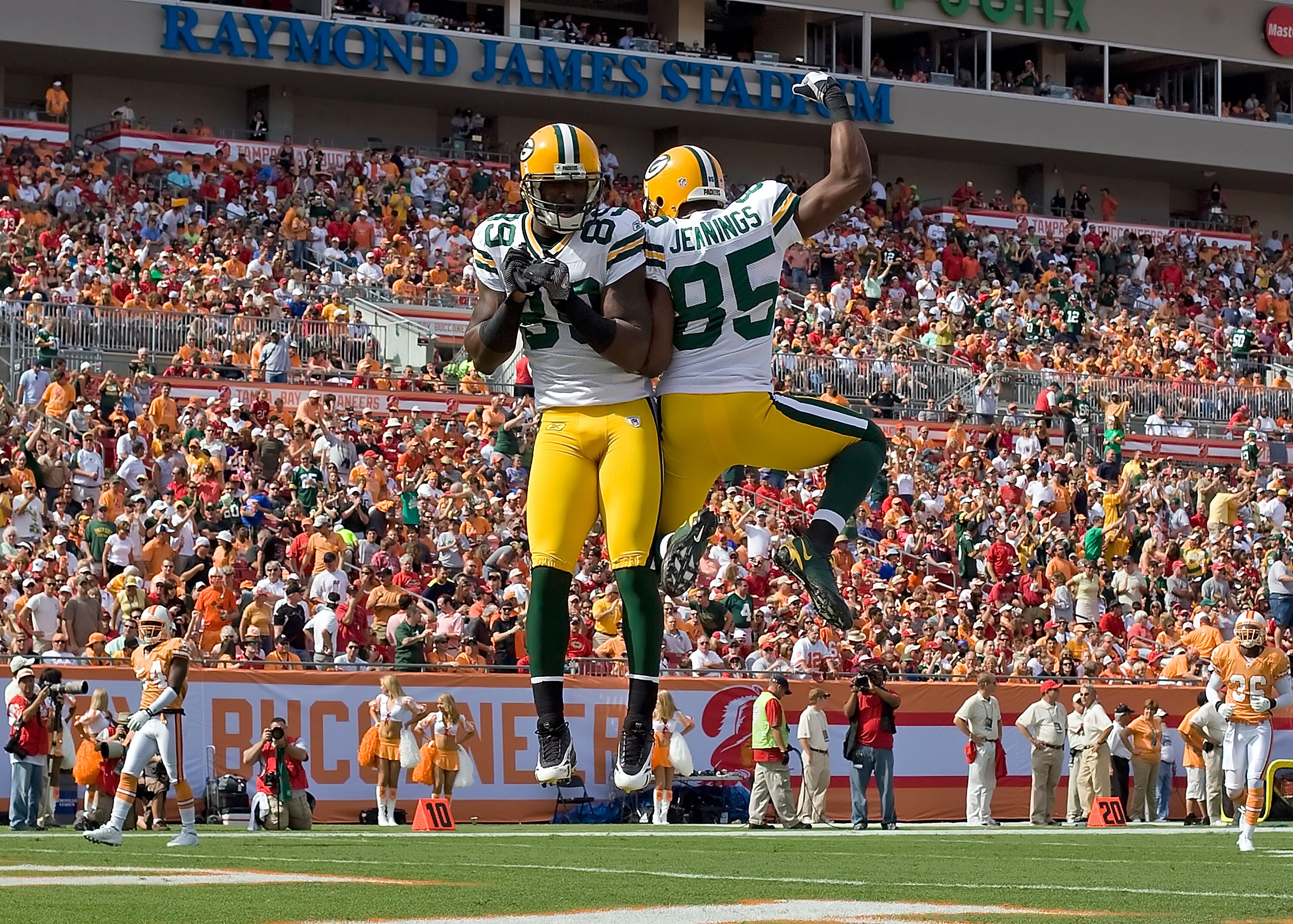 TAMPA, FL - NOVEMBER 08:  Receivers James Jones #89 and Greg Jennings #85 of the Green Bay Packers celebrate Jones' first quarter touchdown against the Tampa Bay Buccaneers during the game at Raymond James Stadium on November 8, 2009 in Tampa, Florida.  (