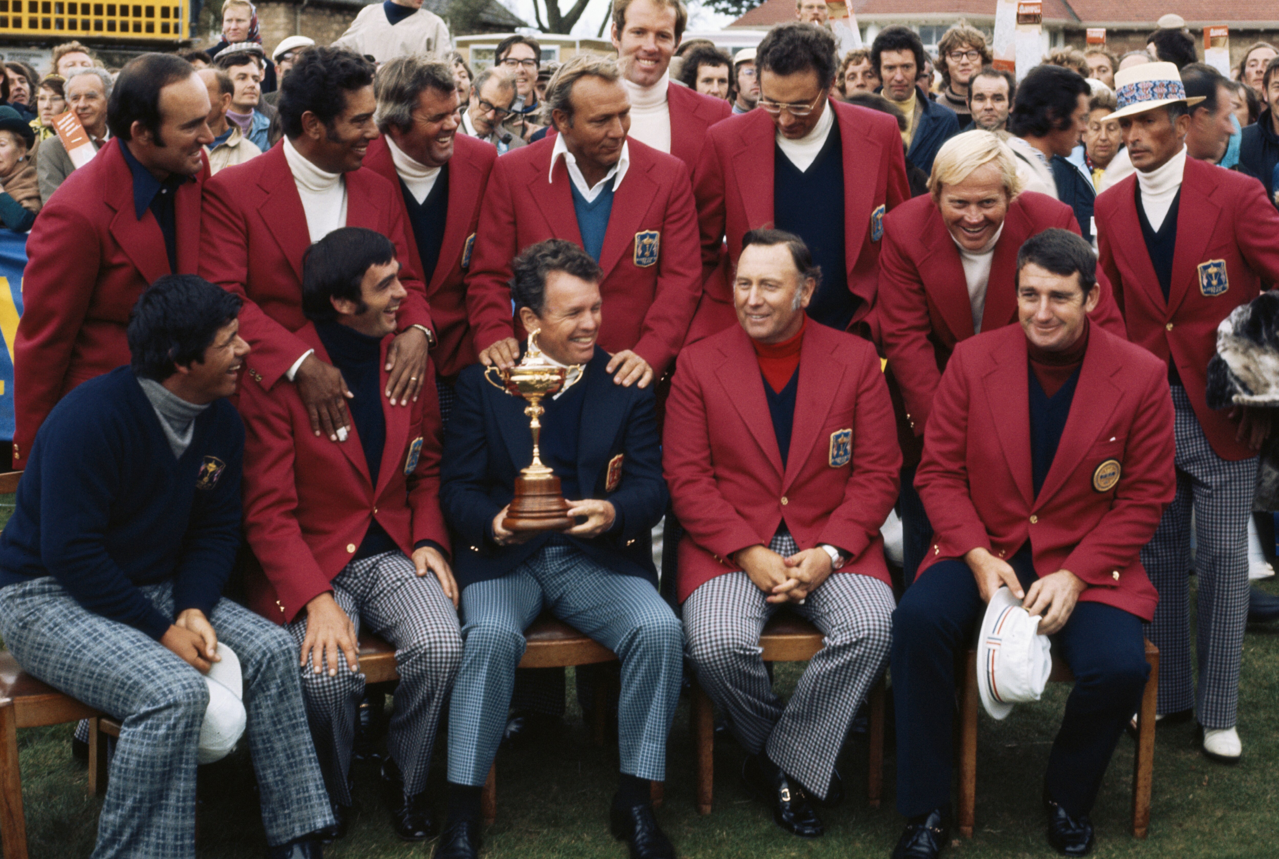 Jack Burke, Jr., Captain of the United States holding the Ryder Cup trophy celebrates with team members Billy Casper,Tom Weiskopf, Homero Blancas, Tommy Aaron, Gay Brewer, J. C. Snead, Jack Nicklaus, Lee Trevino, Lou Graham, Juan Chi Chi Rodriguez, Arnold