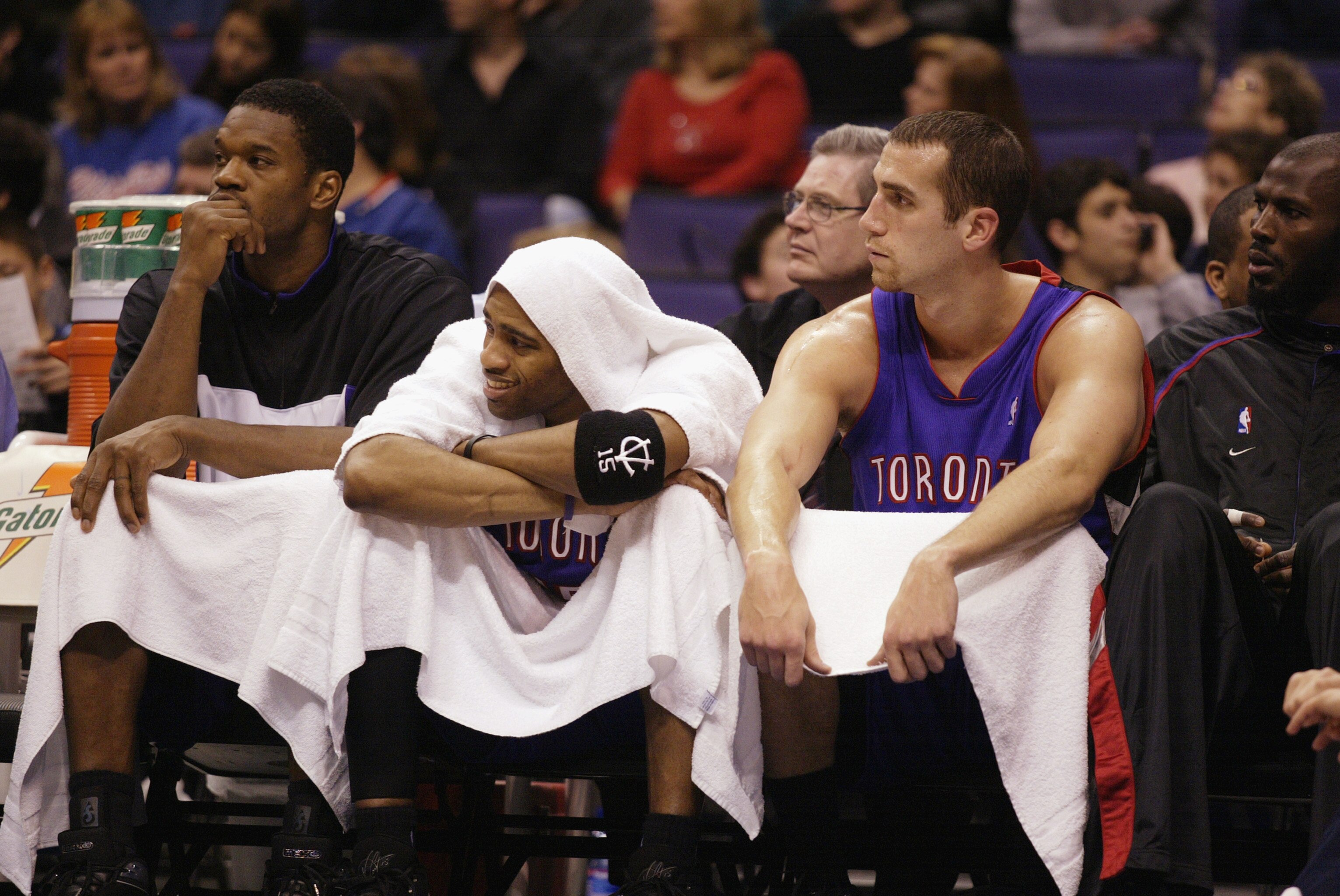 LOS ANGELES - MARCH 16:  (L-R) Antonio Davis #33, Vince Carter #15 and Michael Bradley #5 of the Toronto Raptors look on from the bench during the game against the Los Angeles Clippers on March 16, 2003 at Staples Center in Los Angeles, California.  The C