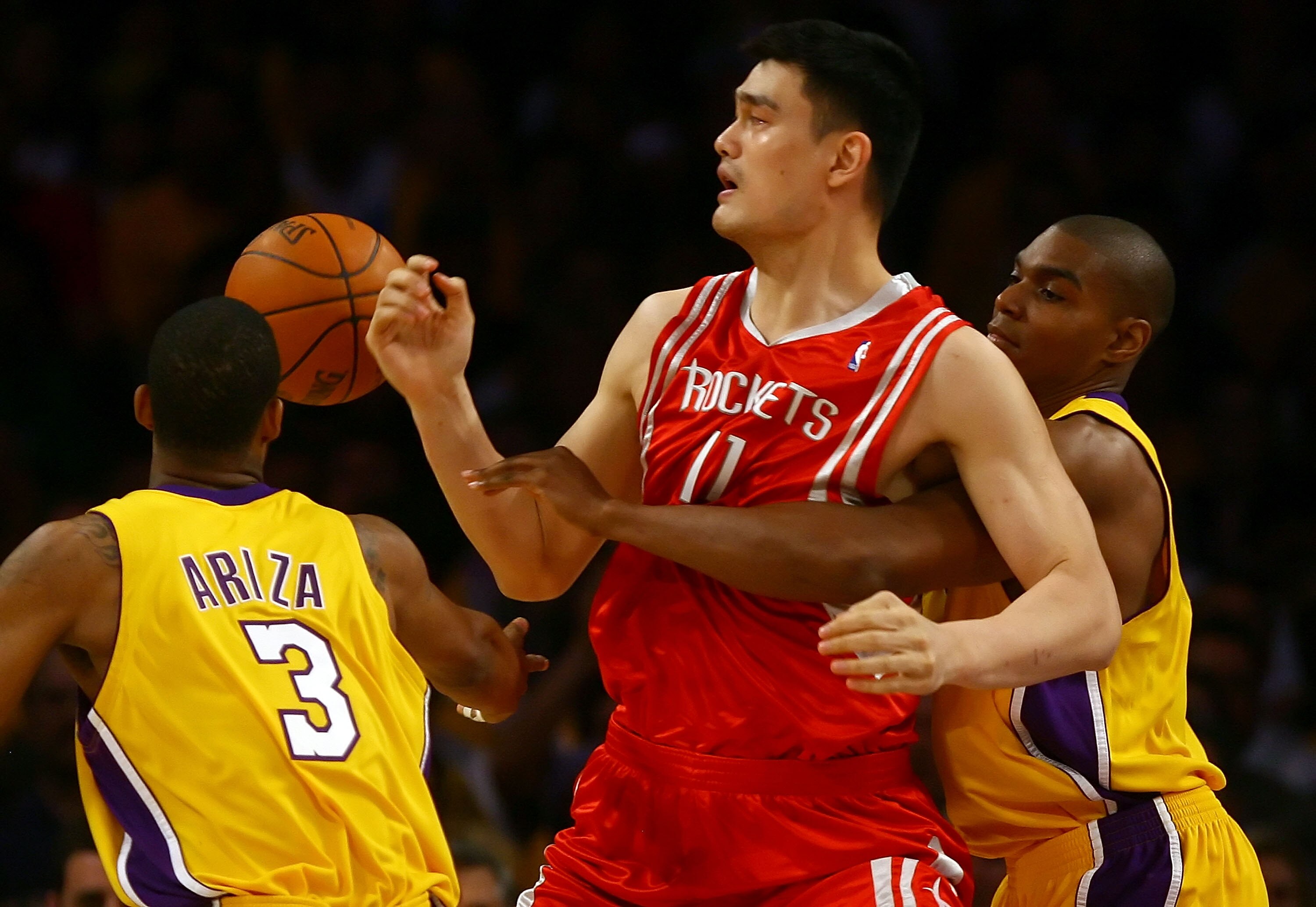 LOS ANGELES, CA - MAY 04:  Andrew Bynum #17 of the Los Angeles Lakers knocks the ball out of the arms of Yao Ming #11 of the Houston Rockets in the first quarter of Game One of the Western Conference Semifinals during the 2009 NBA Playoffs at Staples Cent