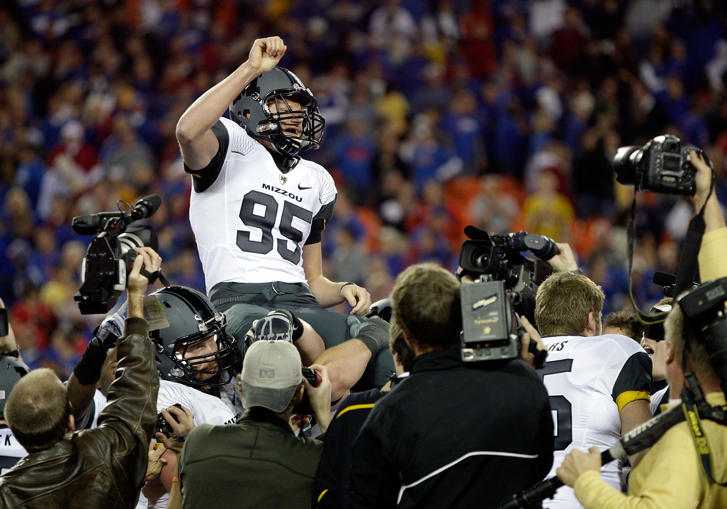 KANSAS CITY, MO - NOVEMBER 28:  Kicker Grant Ressel #95 of the Missouri Tigers is carried off the field after kicking the winning field goal to defeat the Kansas Jayhawks 42-39 to win the game at Arrowhead Stadium on November 28, 2009 in Kansas City, Miss