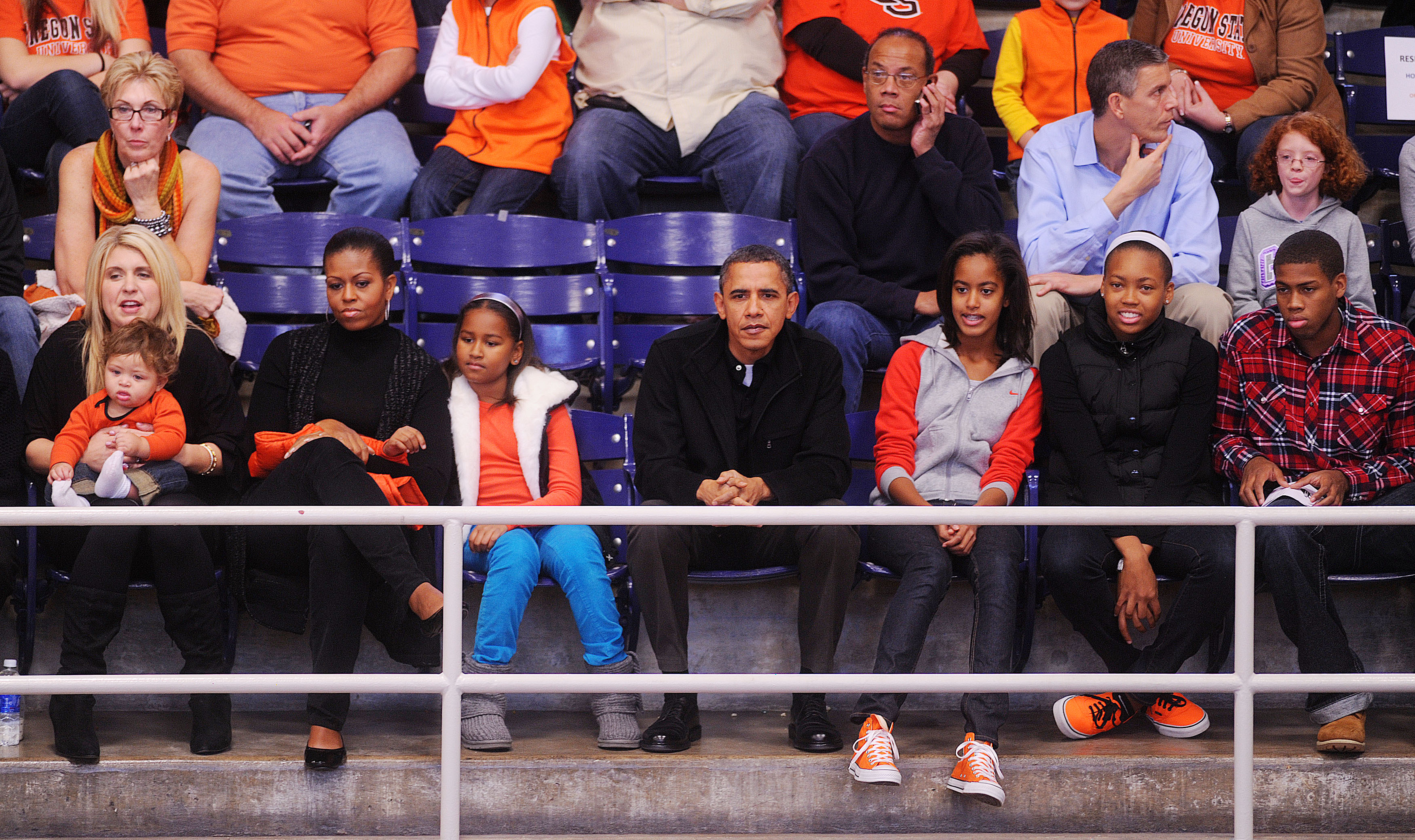 WASHINGTON - NOVEMBER 27:  (AFP OUT) U.S. President Barack Obama with his wife First Lady Michelle Obama  and daughters Malia and Sasha watches a college basketball game at Howard University November 27, 2010 in Washington, DC. President Barack Obama atte