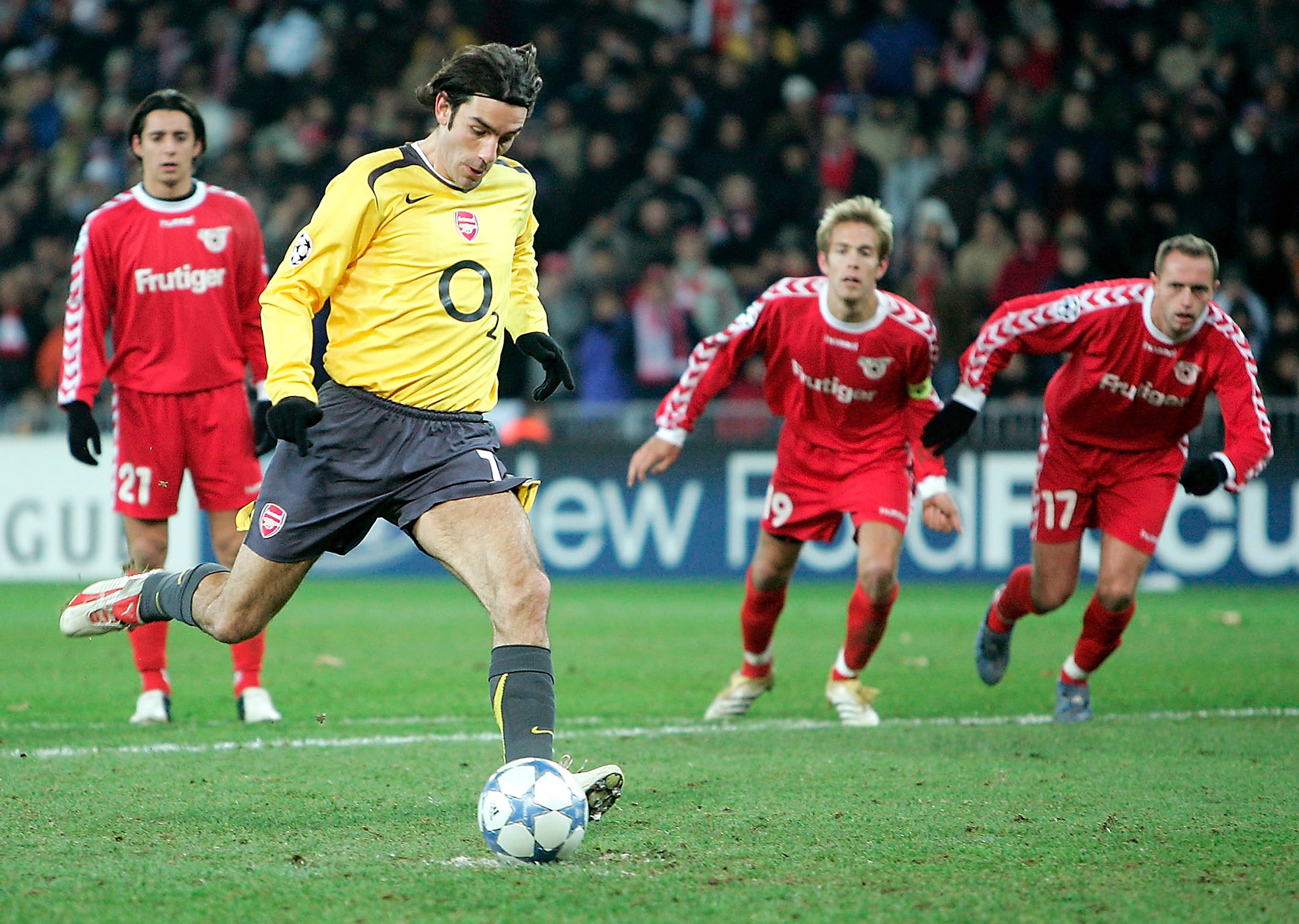 BERNE, SWITZERLAND - NOVEMBER 22:   Robert Pires of Arsenal scores from the penalty spot during the Champions League Group B match between FC Thun and Arsenal at the Stade de Suisse on November 22, 2005 in Berne, Switzerland.  (Photo by Phil Cole/Getty Im