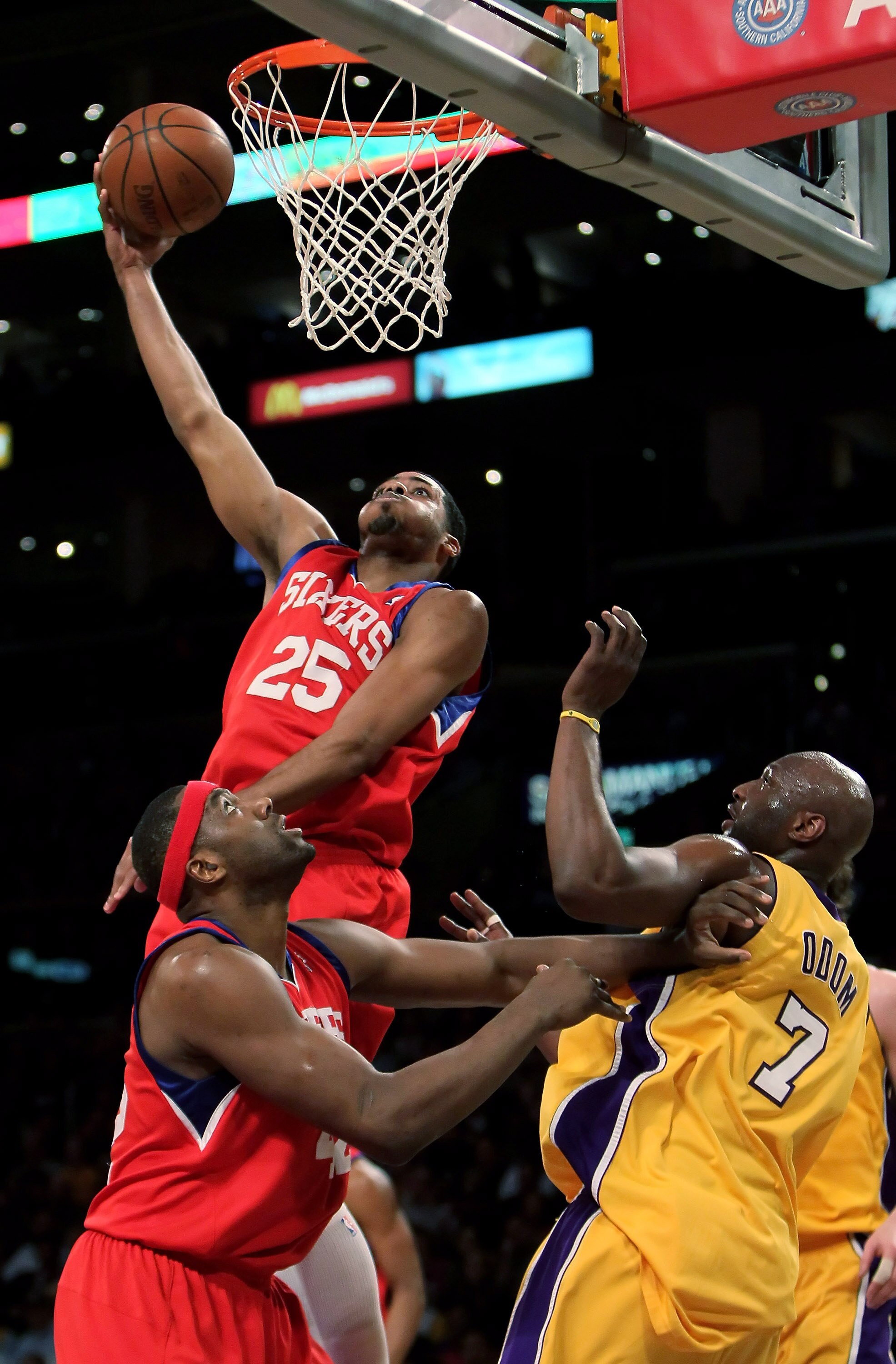 LOS ANGELES, CA - FEBRUARY 26:  Rodney Carney #25 of the Philadelphia 76ers shoots over teammate Elton Brand #42 and Lamar Odom #7 of the Los Angeles Lakers in the first half at Staples Center on February 26, 2010 in Los Angeles, California. NOTE TO USER: