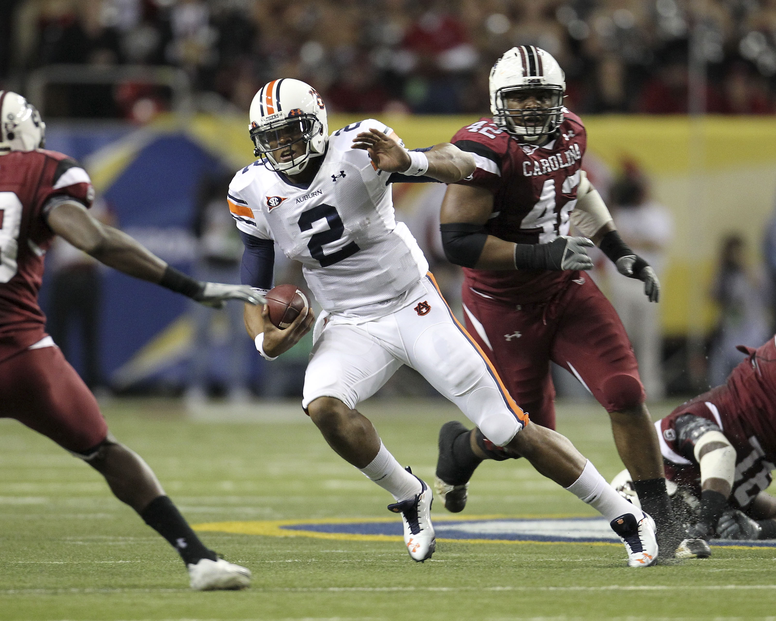 ATLANTA - DECEMBER 04:  Quarterback Cam Newton #2 of the Auburn Tigers runs with the ball during the 2010 SEC Championship against the South Carolina Gamecocks at Georgia Dome on December 4, 2010 in Atlanta, Georgia.  (Photo by Mike Zarrilli/Getty Images)
