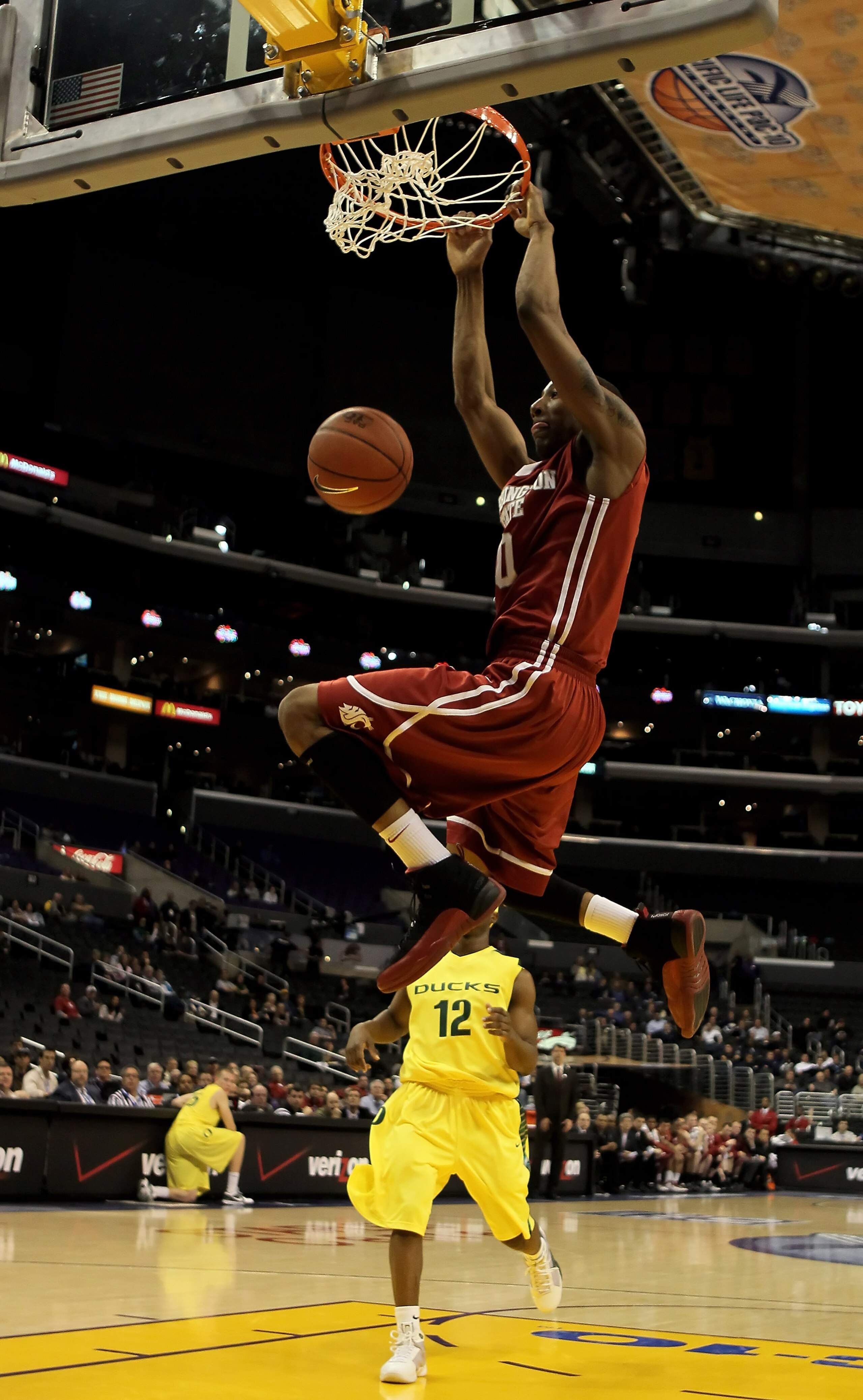 LOS ANGELES, CA - MARCH 10:  Marcus Capers #0 of the Washington State Cougars dunks the ball against the Oregon Ducks in the half during the first round of the Pac-10 Basketball Tournament at Staples Center on March 10, 2010 in Los Angeles, California.  (
