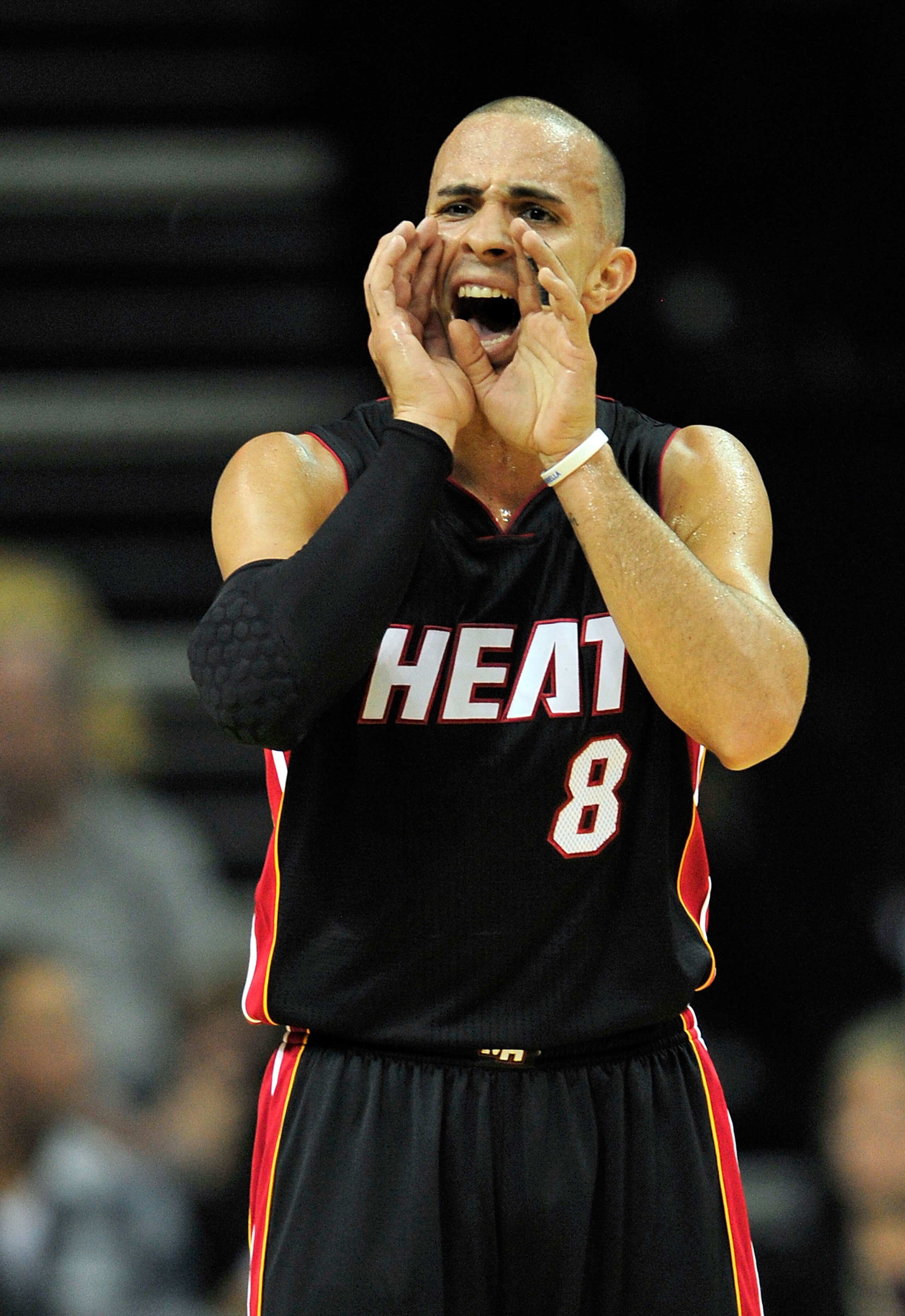 MEMPHIS, TN - NOVEMBER 20:  Carlos Arroyo #8 of the Miami Heat calls out a play against the Memphis Grizzlies at FedExForum on November 20, 2010 in Memphis, Tennessee.  NOTE TO USER: User expressly acknowledges and agrees that, by downloading and or using