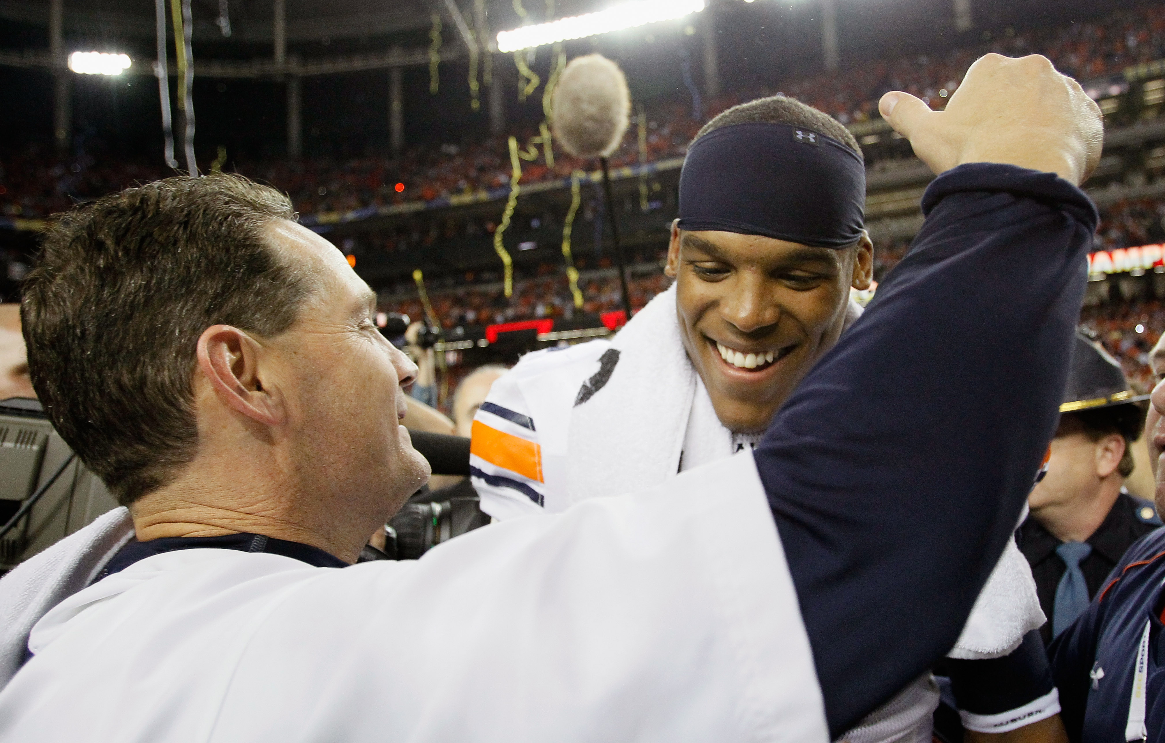 ATLANTA, GA - DECEMBER 04:  Quarterback Cam Newton #2 of the Auburn Tigers celebrates with head coach Gene Chizik after their 56-17 win over the South Carolina Gamecocks during the 2010 SEC Championship at Georgia Dome on December 4, 2010 in Atlanta, Geor