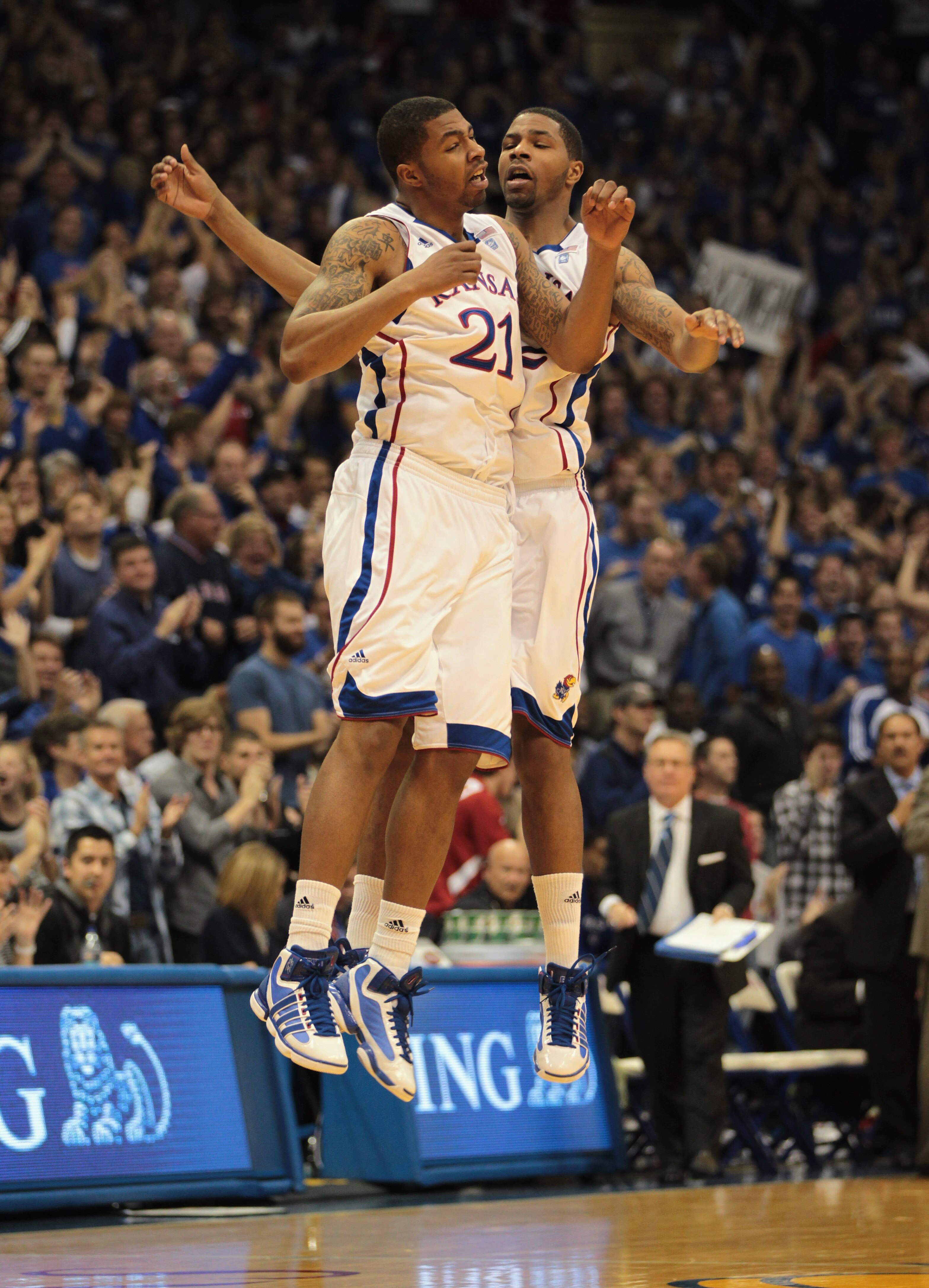 LAWRENCE, KS - DECEMBER 02:  Marcus Morris #22 and Markieff Morris #21 of the Kansas Jayhawks celebrate after a basket during the game against the UCLA Bruins on December 2, 2010 at Allen Fieldhouse in Lawrence, Kansas.  (Photo by Jamie Squire/Getty Image