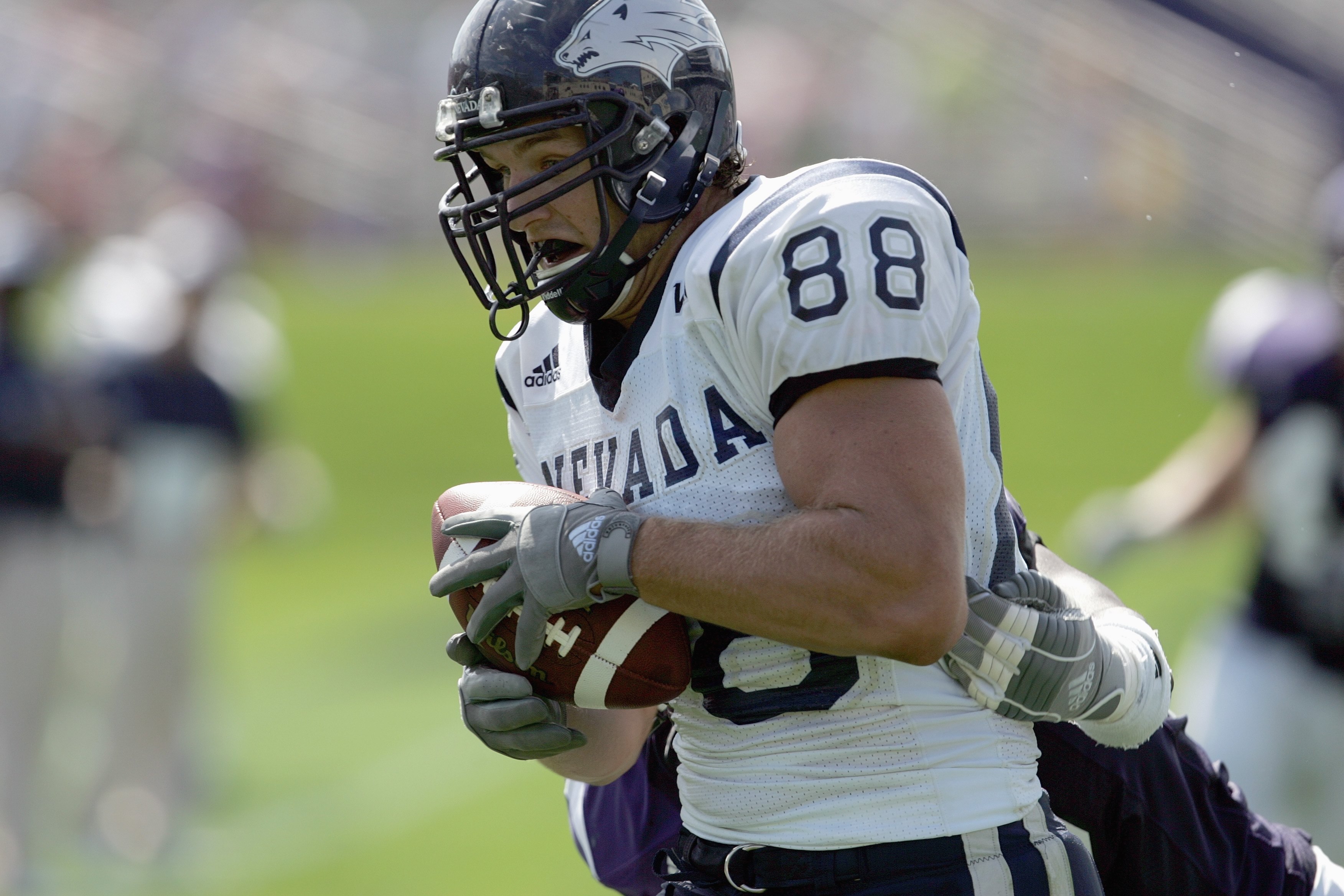EVANSTON, IL - SEPTEMBER 8:  Adam Bishop # 88 of the Nevada Wolf Pack carries the ball against the Northwestern Wildcats on September 8, 2007 at Ryan Field at Northwestern University in Evanston, Illinois. (Photo by Jonathan Daniel/Getty Images)