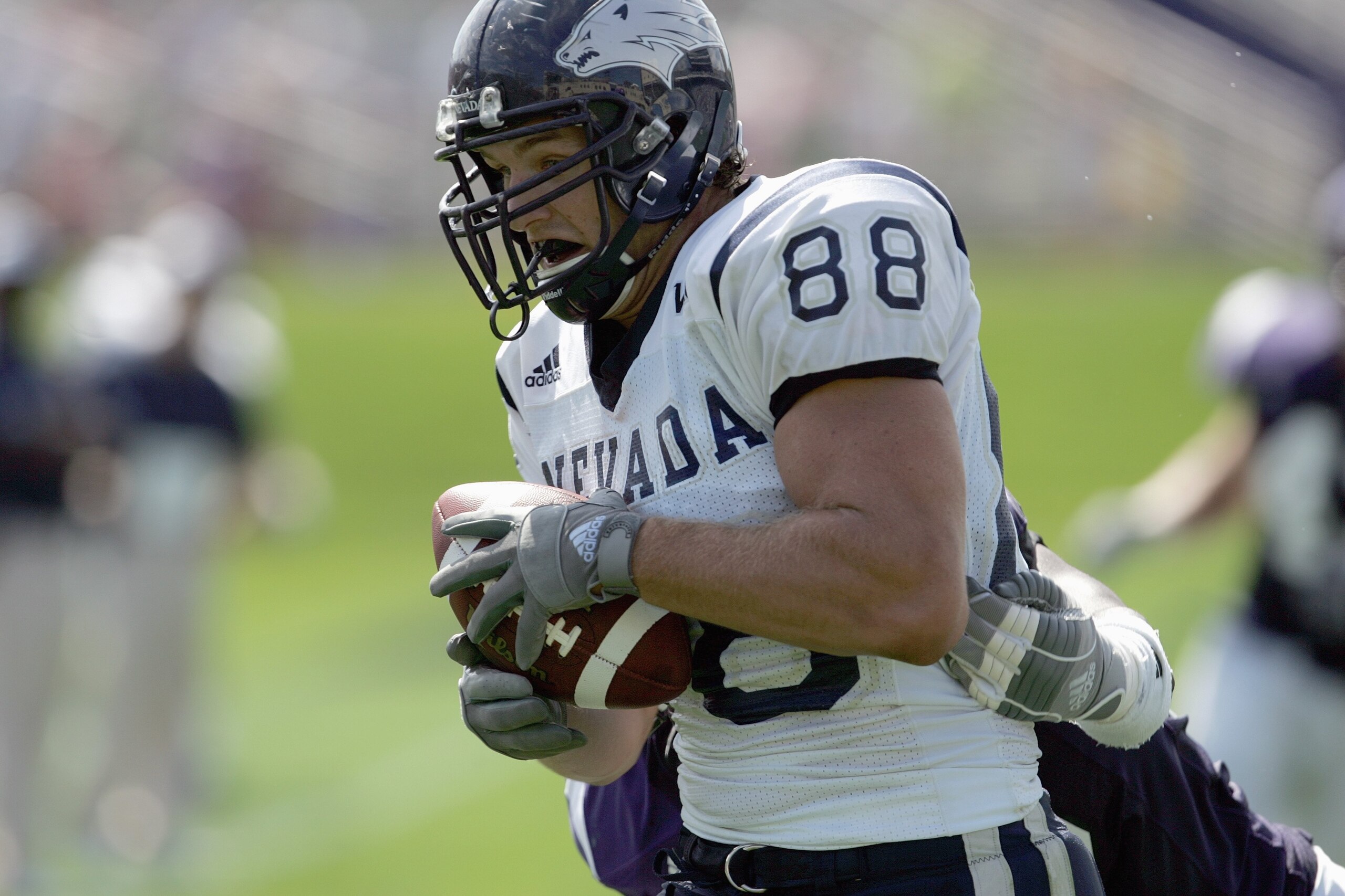 EVANSTON, IL - SEPTEMBER 8:  Adam Bishop # 88 of the Nevada Wolf Pack carries the ball against the Northwestern Wildcats on September 8, 2007 at Ryan Field at Northwestern University in Evanston, Illinois. (Photo by Jonathan Daniel/Getty Images)