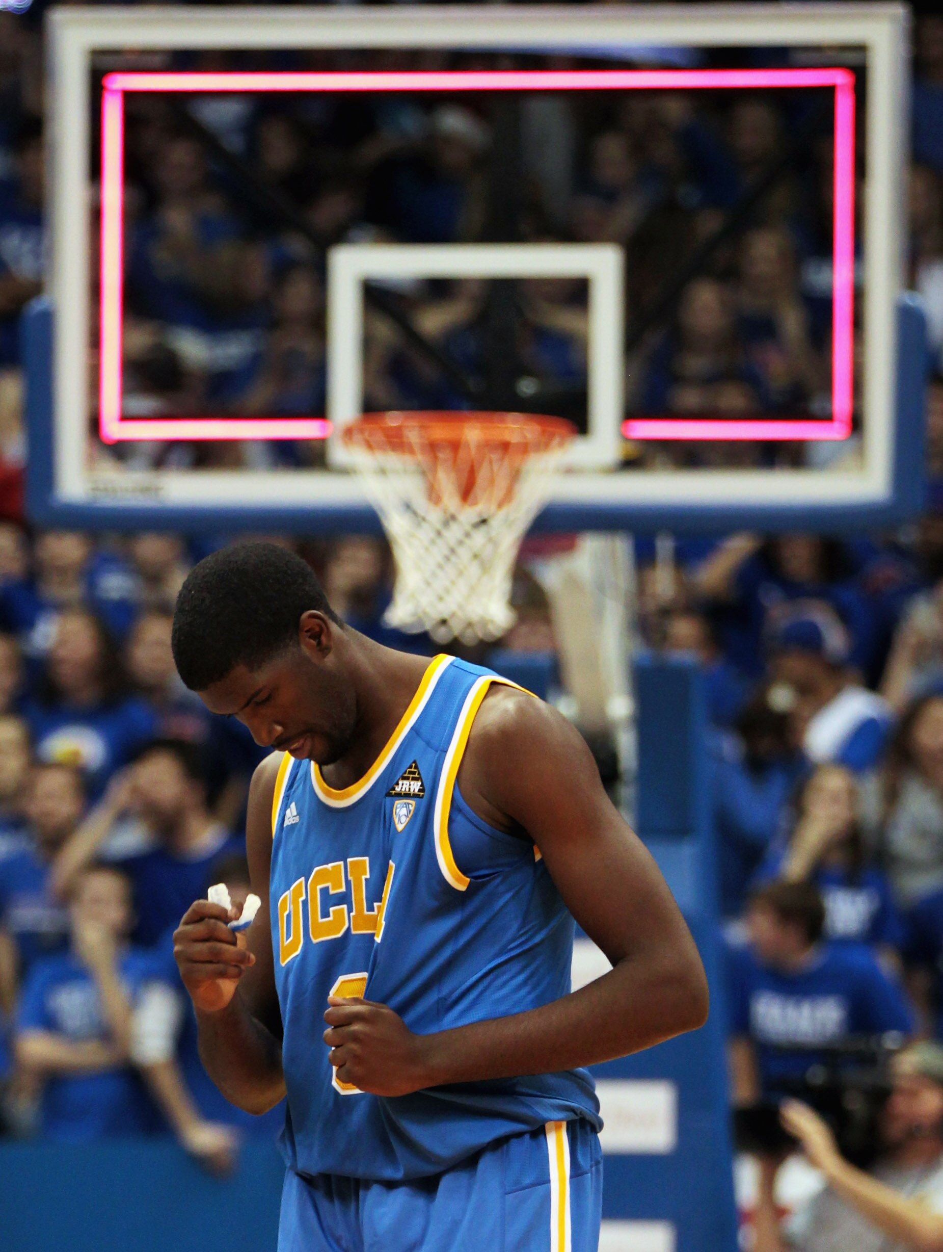 LAWRENCE, KS - DECEMBER 02:  Anthony Stover #0 of the UCLA Bruins reacts as he walks off the court after the Kansas Jayhawks defeated the Bruins with a final score of 77-76 to win the game on December 2, 2010 at Allen Fieldhouse in Lawrence, Kansas.  (Pho