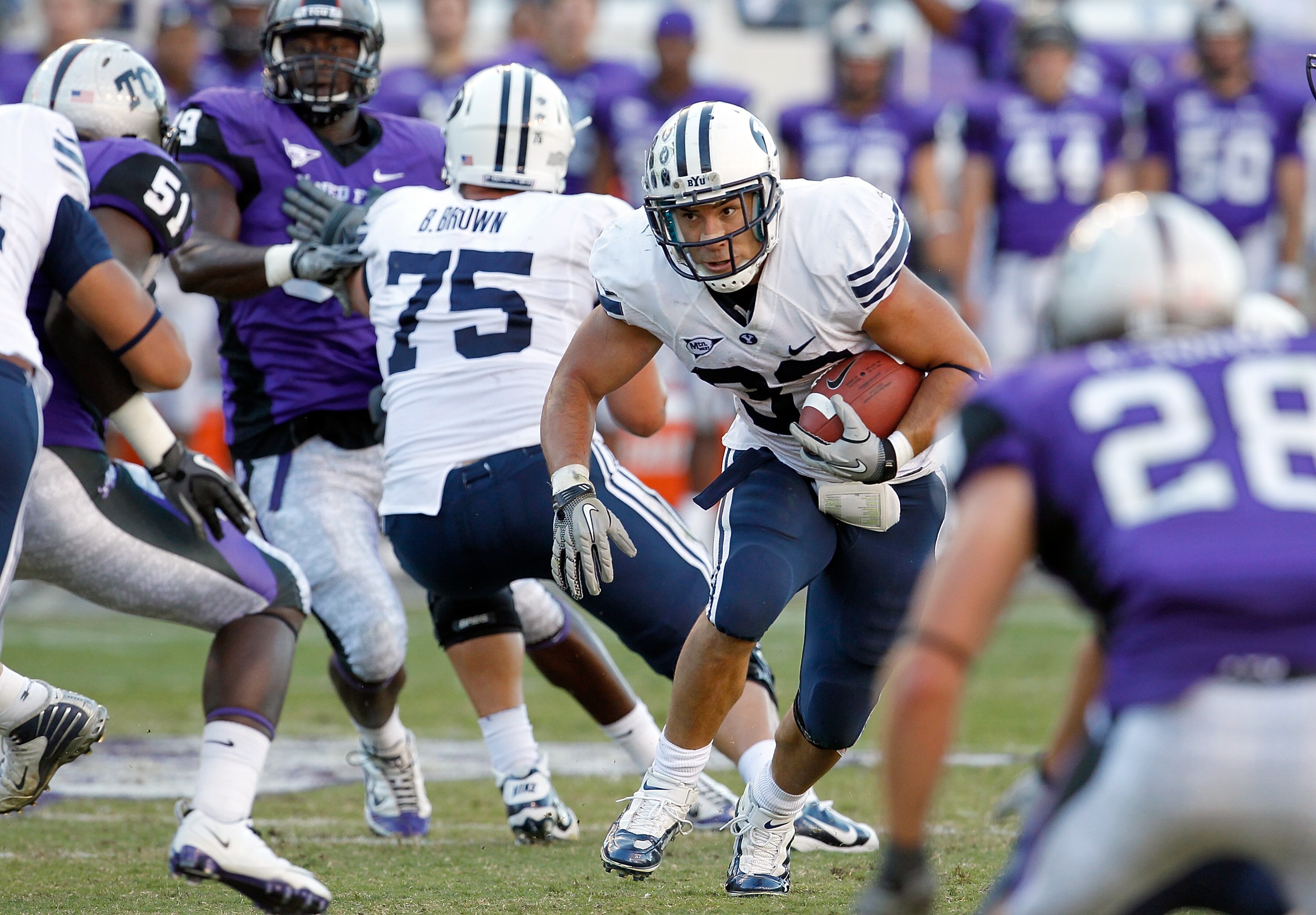 FORT WORTH, TX - OCTOBER 16:  Running back Bryan Kariya #33 of the BYU Cougars carries the ball against the TCU Horned Frogs at Amon G. Carter Stadium on October 16, 2010 in Fort Worth, Texas. TCU beat BYU 31-3.  (Photo by Tom Pennington/Getty Images)