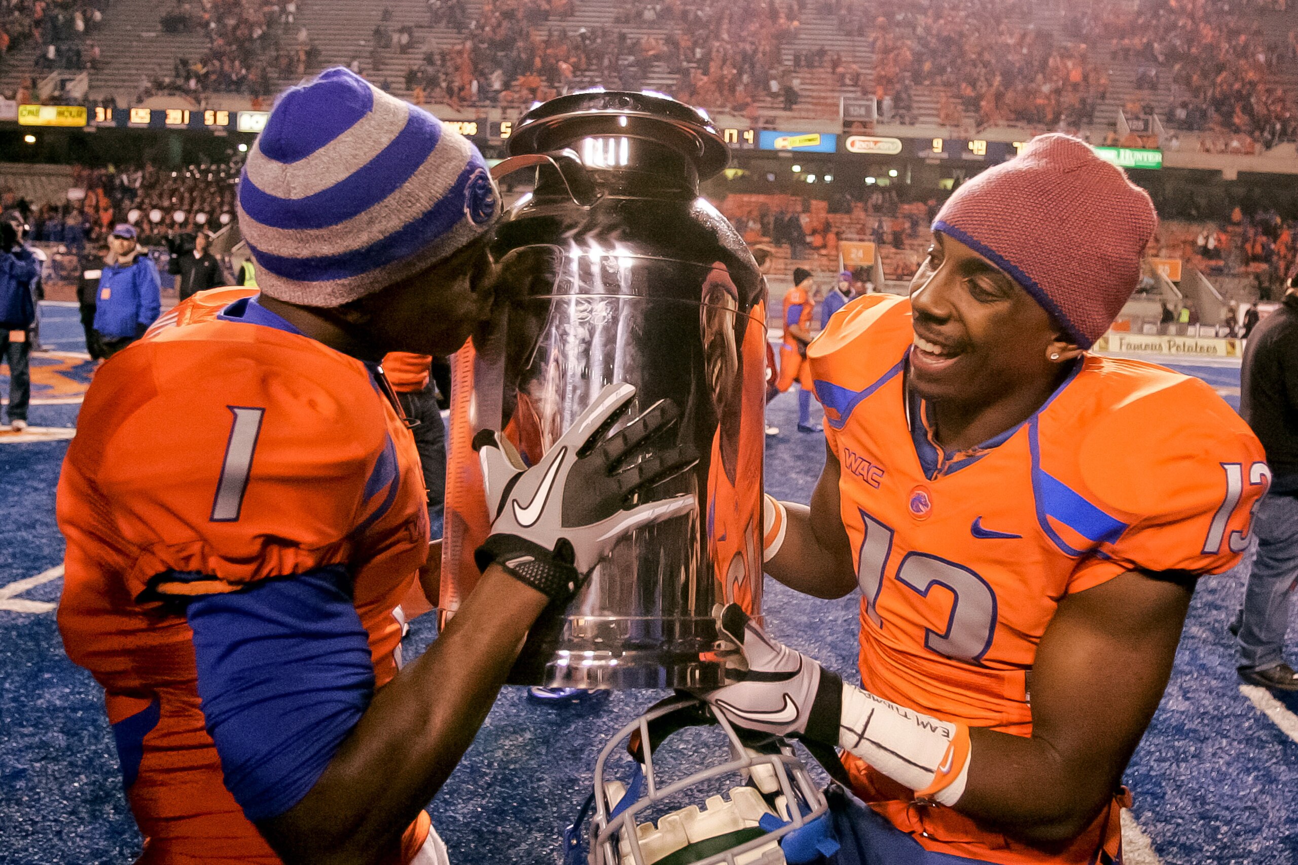 BOISE, ID - NOVEMBER 19: Titus Young #1 kisses and Brandyn Thompson #13 of the Boise State Broncos carries the Milk Can, which is the Boise State - Fresno State rivalry trophy, at Bronco Stadium on November 19, 2010 in Boise, Idaho. (Photo by Otto Kitsi BOISE, ID - NOVEMBER 19: Titus Young #1 kisses and Brandyn Thompson #13 of the Boise State Broncos carries the Milk Can, which is the Boise State - Fresno State rivalry trophy, at Bronco Stadium on November 19, 2010 in Boise, Idaho. (Photo by Otto Kitsi