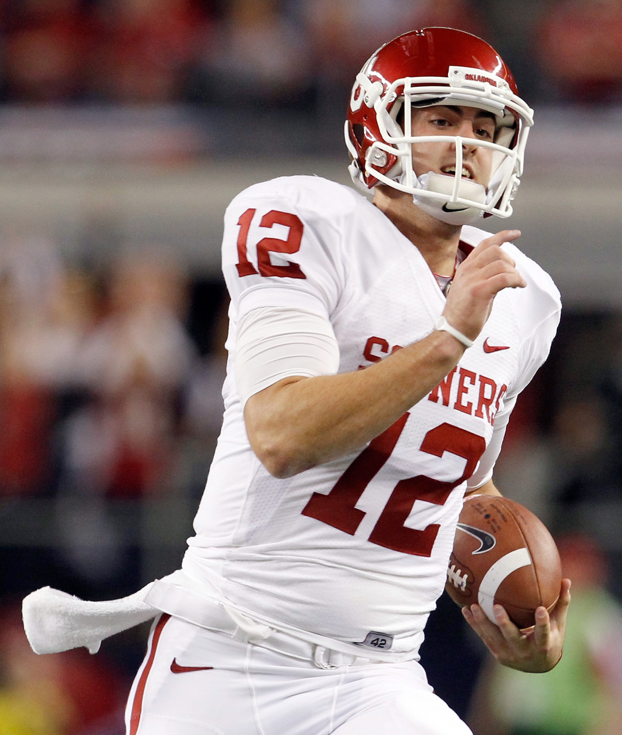ARLINGTON, TX - DECEMBER 04: Quarterback Landry Jones #12 of the Oklahoma Sooners carries the ball against the Nebraska Cornhuskers at Cowboys Stadium on December 4, 2010 in Arlington, Texas. The Sooners beat the Cornhuskers 23-20. (Photo by Tom Pennin ARLINGTON, TX - DECEMBER 04: Quarterback Landry Jones #12 of the Oklahoma Sooners carries the ball against the Nebraska Cornhuskers at Cowboys Stadium on December 4, 2010 in Arlington, Texas. The Sooners beat the Cornhuskers 23-20. (Photo by Tom Pennin