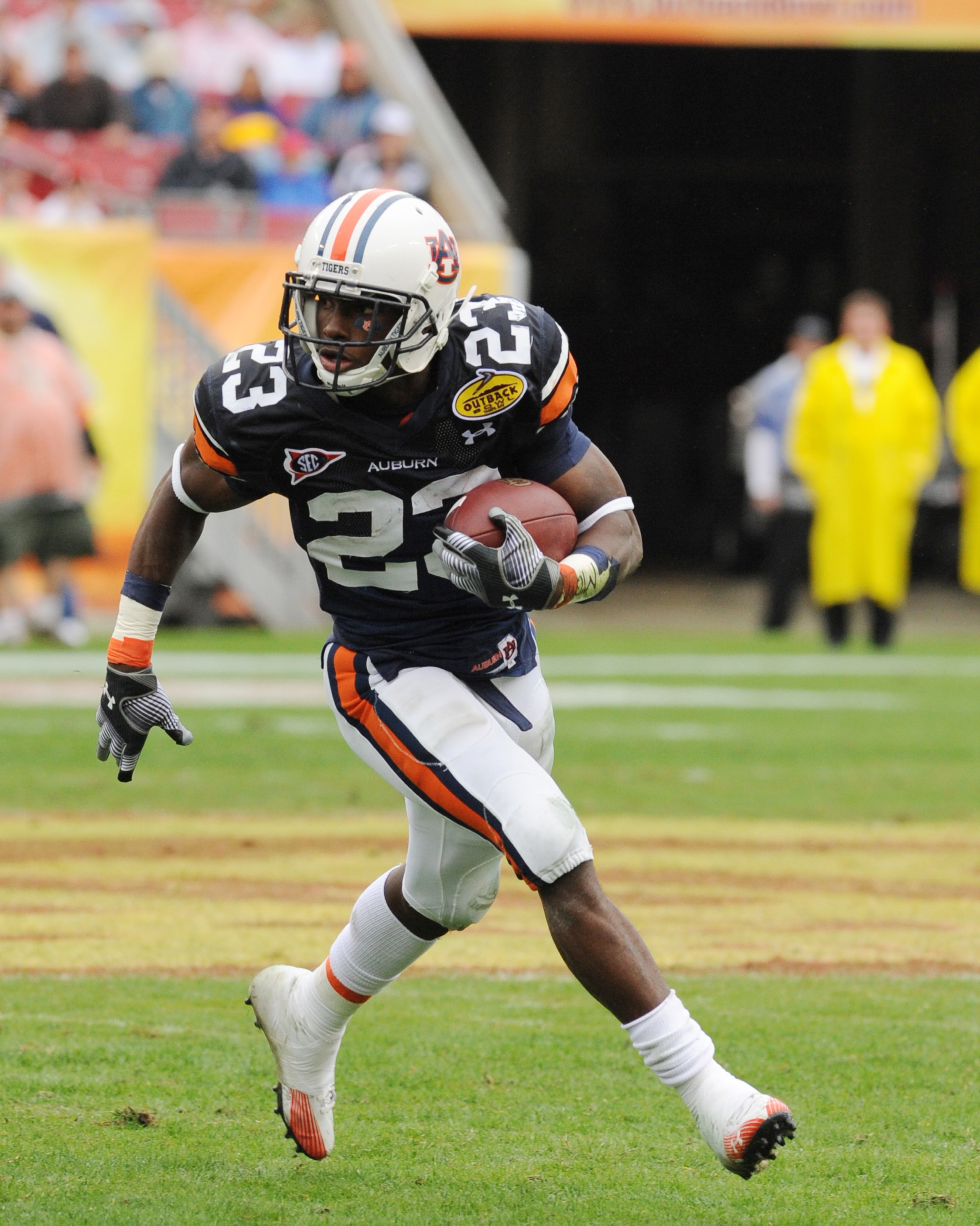 TAMPA, FL - JANUARY 1: Running back Onterio McCalebb #23 of the Auburn Tigers rushes upfield against the Northwestern Wildcats in the Outback Bowl January 1, 2010 at Raymond James Stadium in Tampa, Florida.  (Photo by Al Messerschmidt/Getty Images)