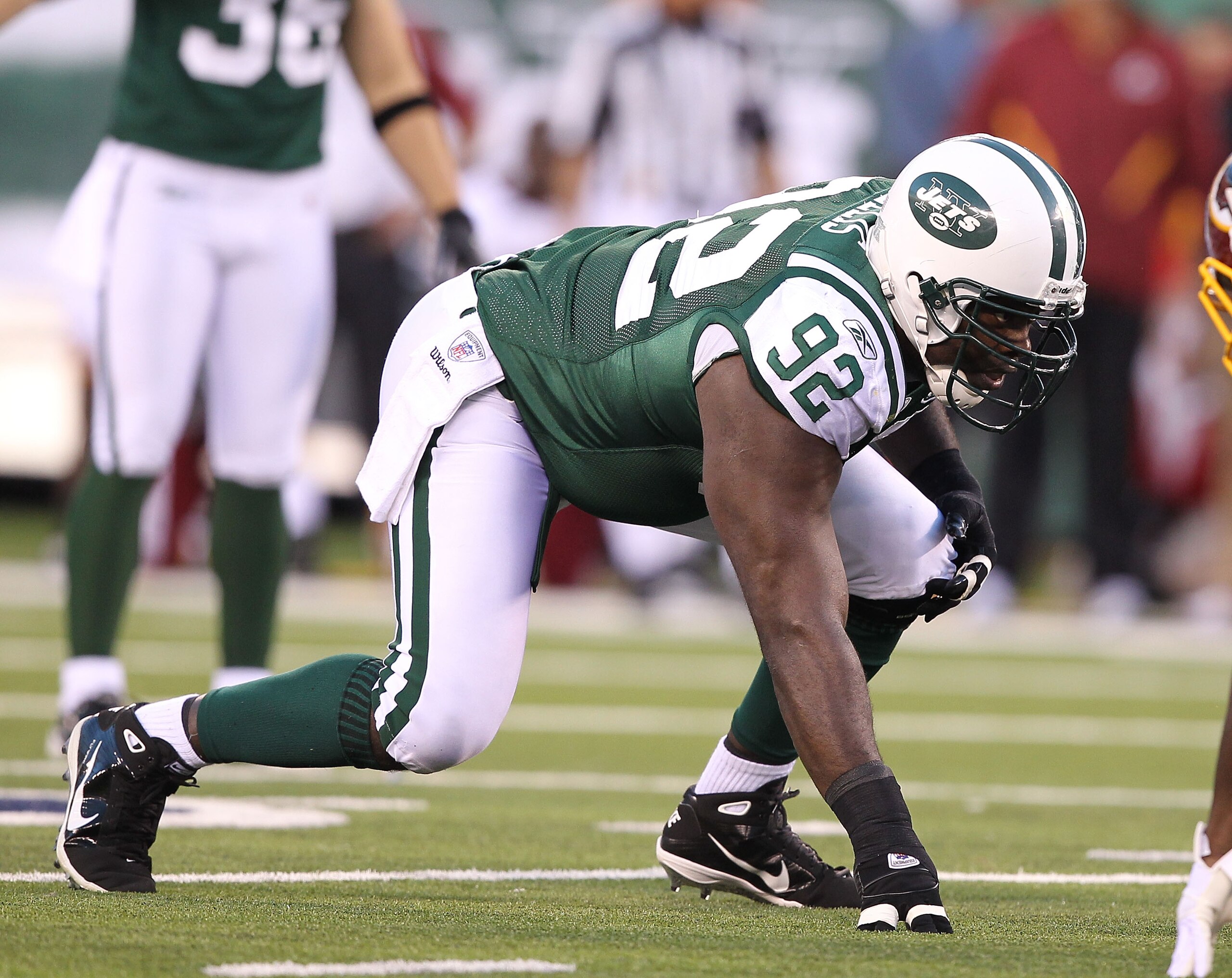 EAST RUTHERFORD, NJ - AUGUST 27:  Shaun Ellis #92 of the New York Jets in action against the Washington Redskins  during their preseason game on August 27, 2010 at the New Meadowlands Stadium  in East Rutherford, New Jersey.  (Photo by Al Bello/Getty Imag