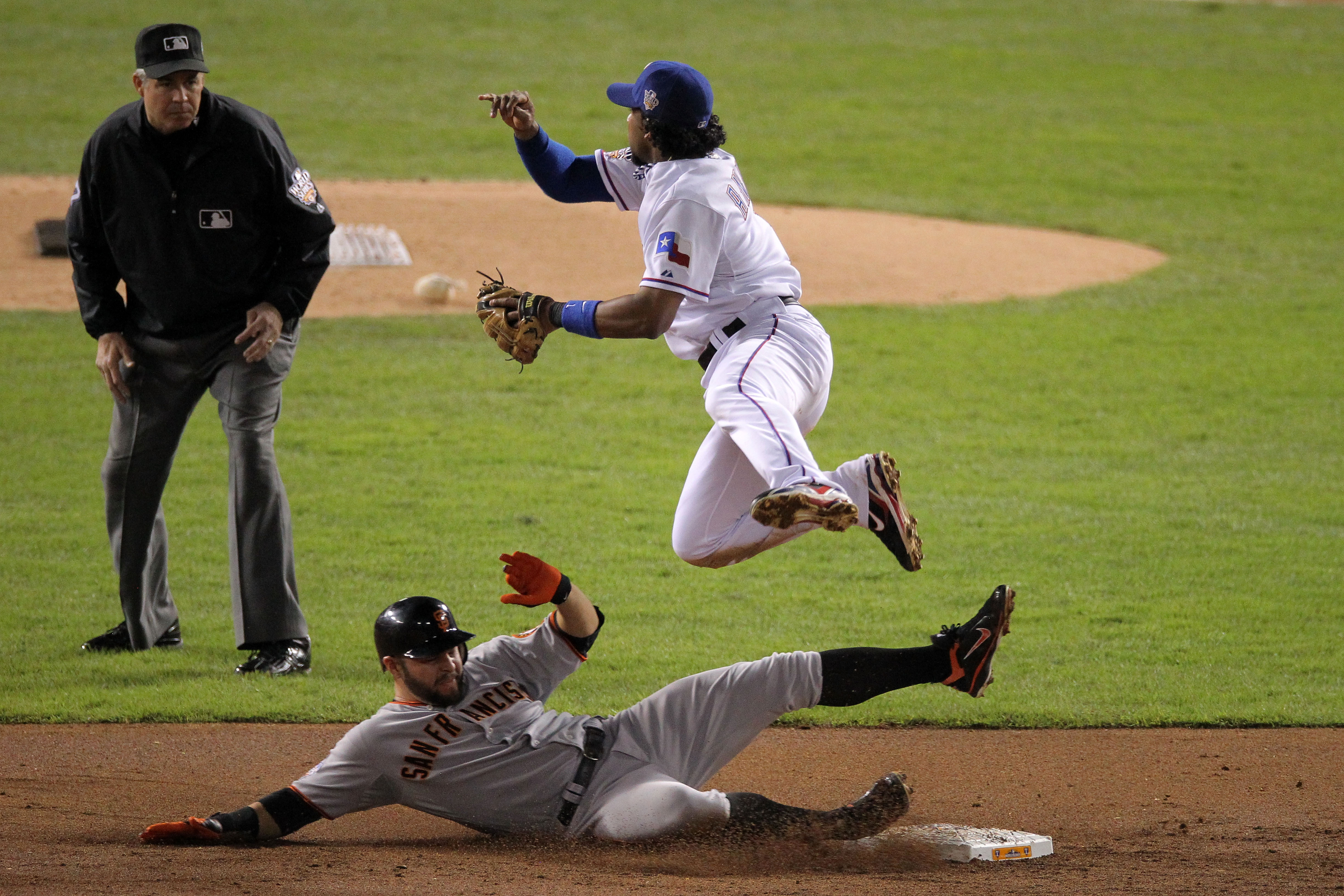 ARLINGTON, TX - OCTOBER 31:  Cody Ross #13 of the San Francisco Giants is forced out at second base off a ground ball by teammate Travis Ishikawa #10 (not pictured) who was safe at first during the second inning against the Texas Rangers in Game Four of t