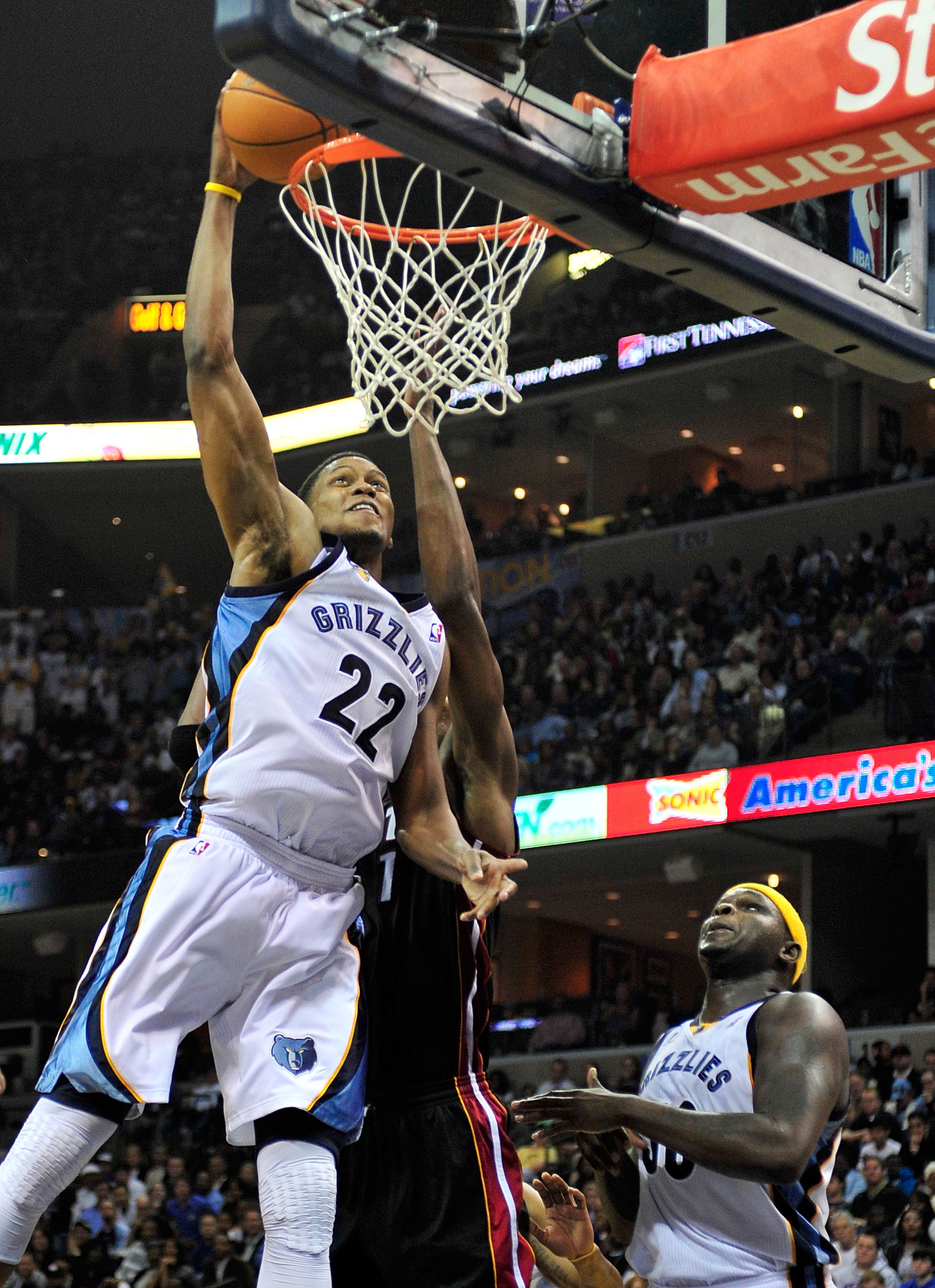 MEMPHIS, TN - NOVEMBER 20: Rudy Gay #22 of the Memphis Grizzlies dunks over Chris Bosh #1 of the Miami Heat at FedExForum on November 20, 2010 in Memphis, Tennessee. The Grizzlies won 97-95. NOTE TO USER: User expressly acknowledges and agrees that, by MEMPHIS, TN - NOVEMBER 20: Rudy Gay #22 of the Memphis Grizzlies dunks over Chris Bosh #1 of the Miami Heat at FedExForum on November 20, 2010 in Memphis, Tennessee. The Grizzlies won 97-95. NOTE TO USER: User expressly acknowledges and agrees that, by