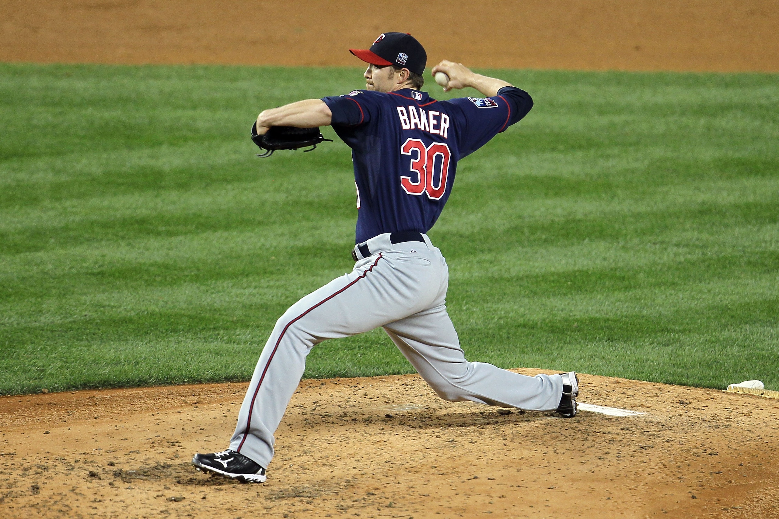 NEW YORK - OCTOBER 09:  Scott Baker #30 of the Minnesota Twins throws a pitch against the New York Yankees during Game Three of the ALDS part of the 2010 MLB Playoffs at Yankee Stadium on October 9, 2010 in the Bronx borough of New York City.  (Photo by C