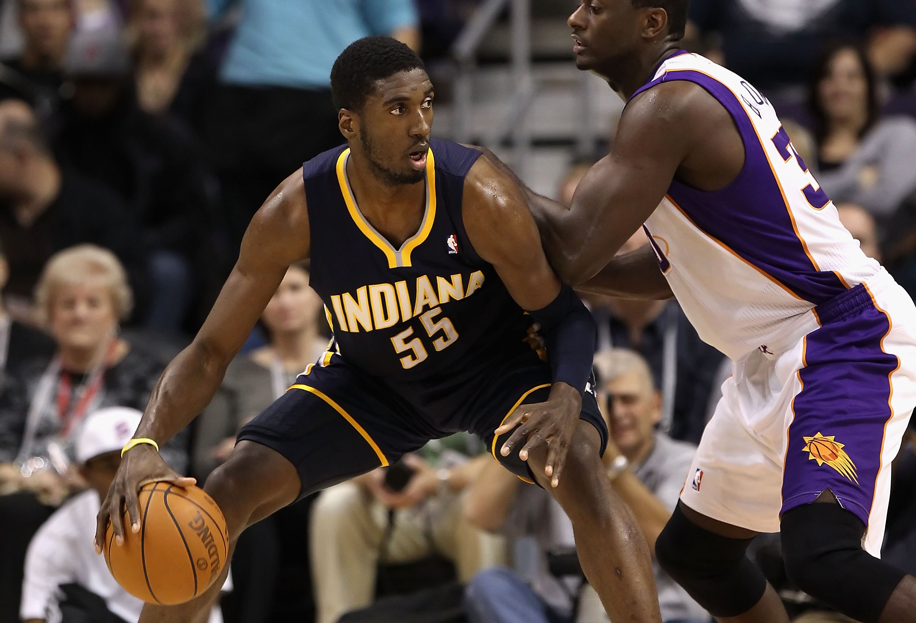 PHOENIX - DECEMBER 03:  Roy Hibbert #55 of the Indiana Pacers handles the ball during the NBA game against the Phoenix Suns at US Airways Center on December 3, 2010 in Phoenix, Arizona.  The Suns defeated the Pacers 105-97.  NOTE TO USER: User expressly a
