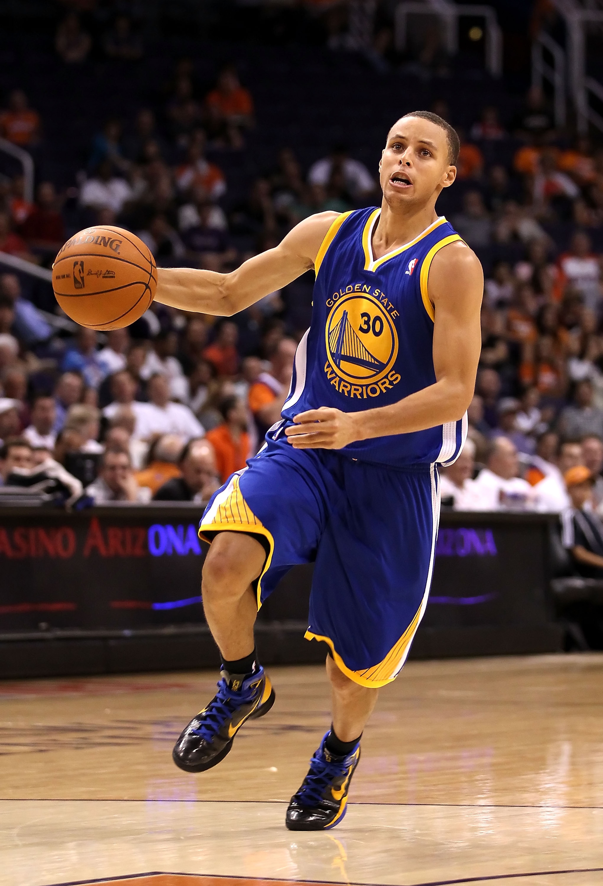 PHOENIX - OCTOBER 19:  Stephen Curry #30 of the Golden State Warriors drives to the basket during the preseason NBA game against the Phoenix Suns at US Airways Center on October 19, 2010 in Phoenix, Arizona. NOTE TO USER: User expressly acknowledges and a