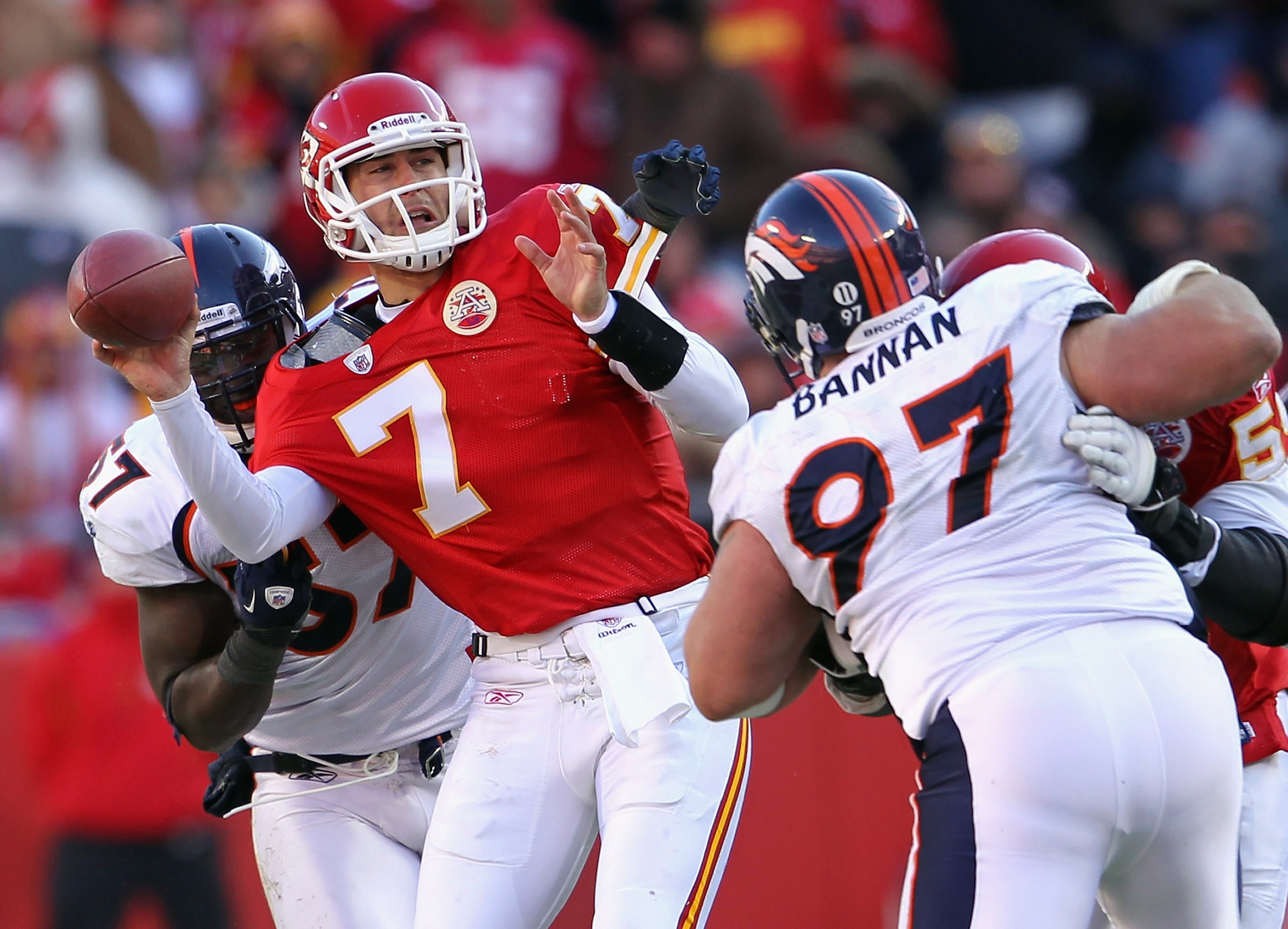 KANSAS CITY, MO - DECEMBER 05:  Quarterback Matt Cassel #7 of the Kansas City Chiefs is pressured by Mario Haggan #57 and Justin Bannan #97 of the Denver Broncos during the game on December 5, 2010 at Arrowhead Stadium in Kansas City, Missouri.  (Photo by