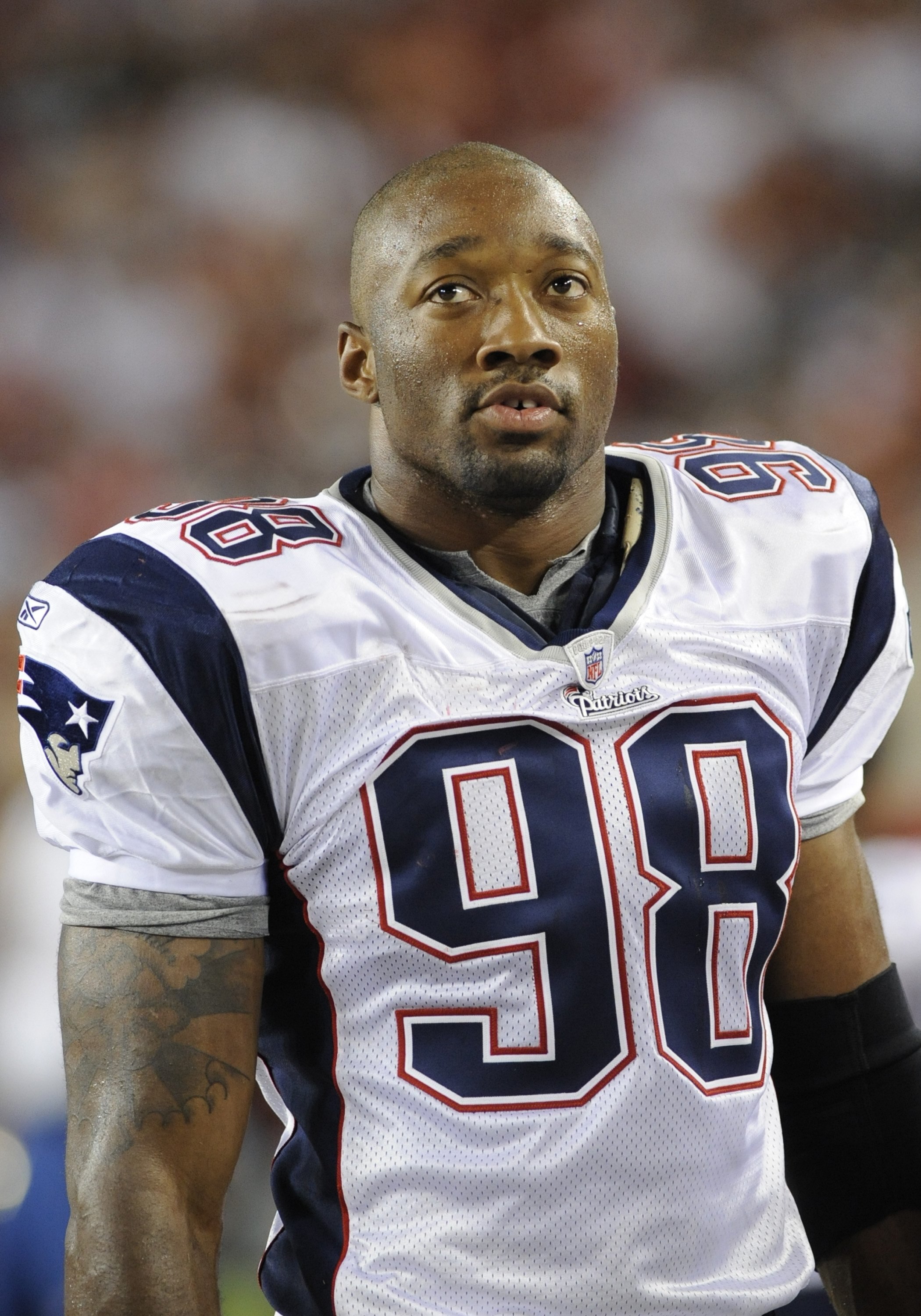 TAMPA, FL - AUGUST 17: Linebacker Shawn Crable #98 of the New England Patriots watches play against the Tampa Bay Buccaneers at Raymond James Stadium on August 17, 2008 in Tampa, Florida.   (Photo by Al Messerschmidt/Getty Images)