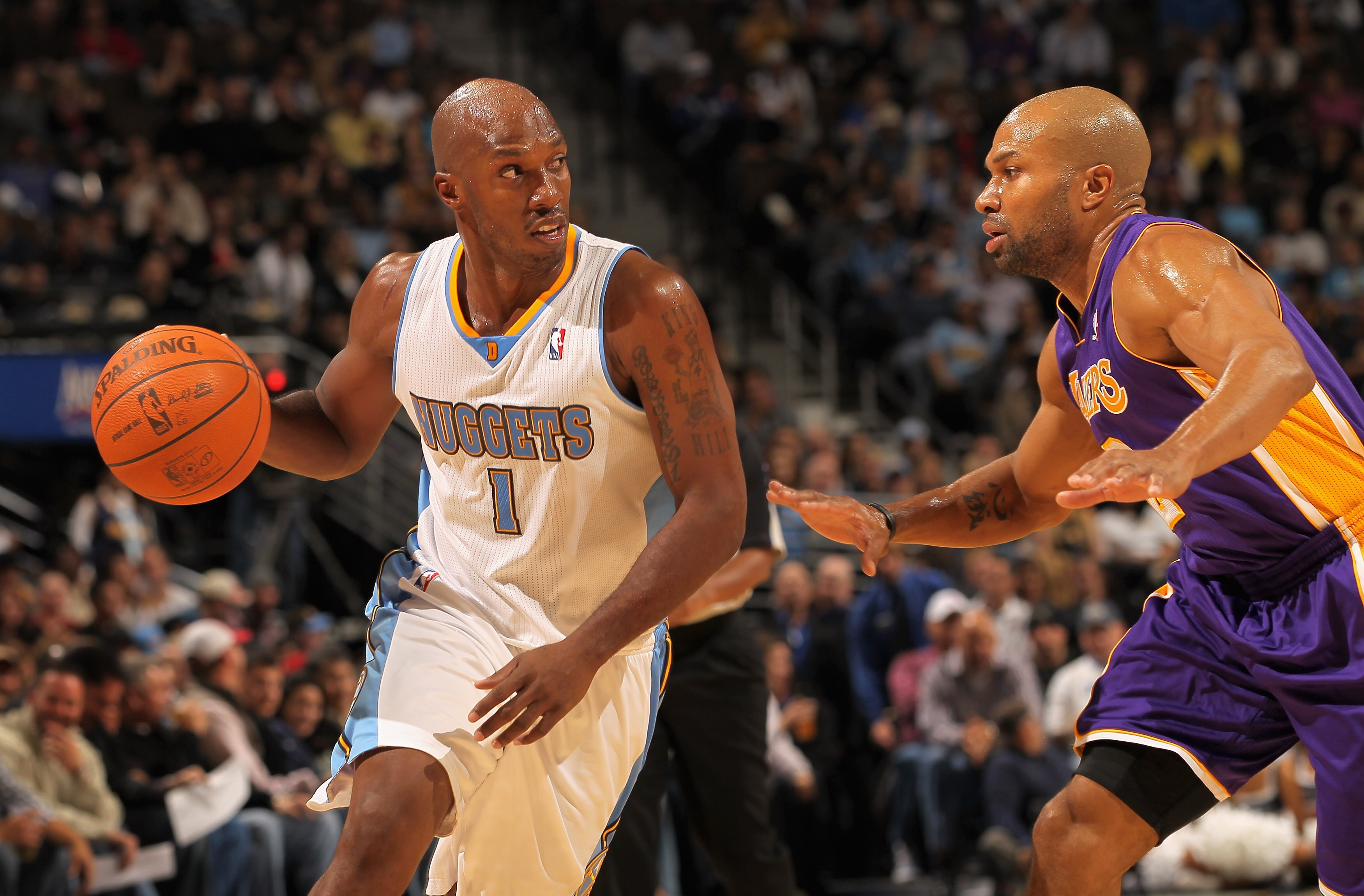 DENVER - NOVEMBER 11:  Chauncey Billups #1 of the Denver Nuggets drives against Derek Fisher #2 of the Los Angeles Lakers at the Pepsi Center on November 11, 2010 in Denver, Colorado. The Nuggets defeated the Lakers 118-112.  NOTE TO USER: User expressly
