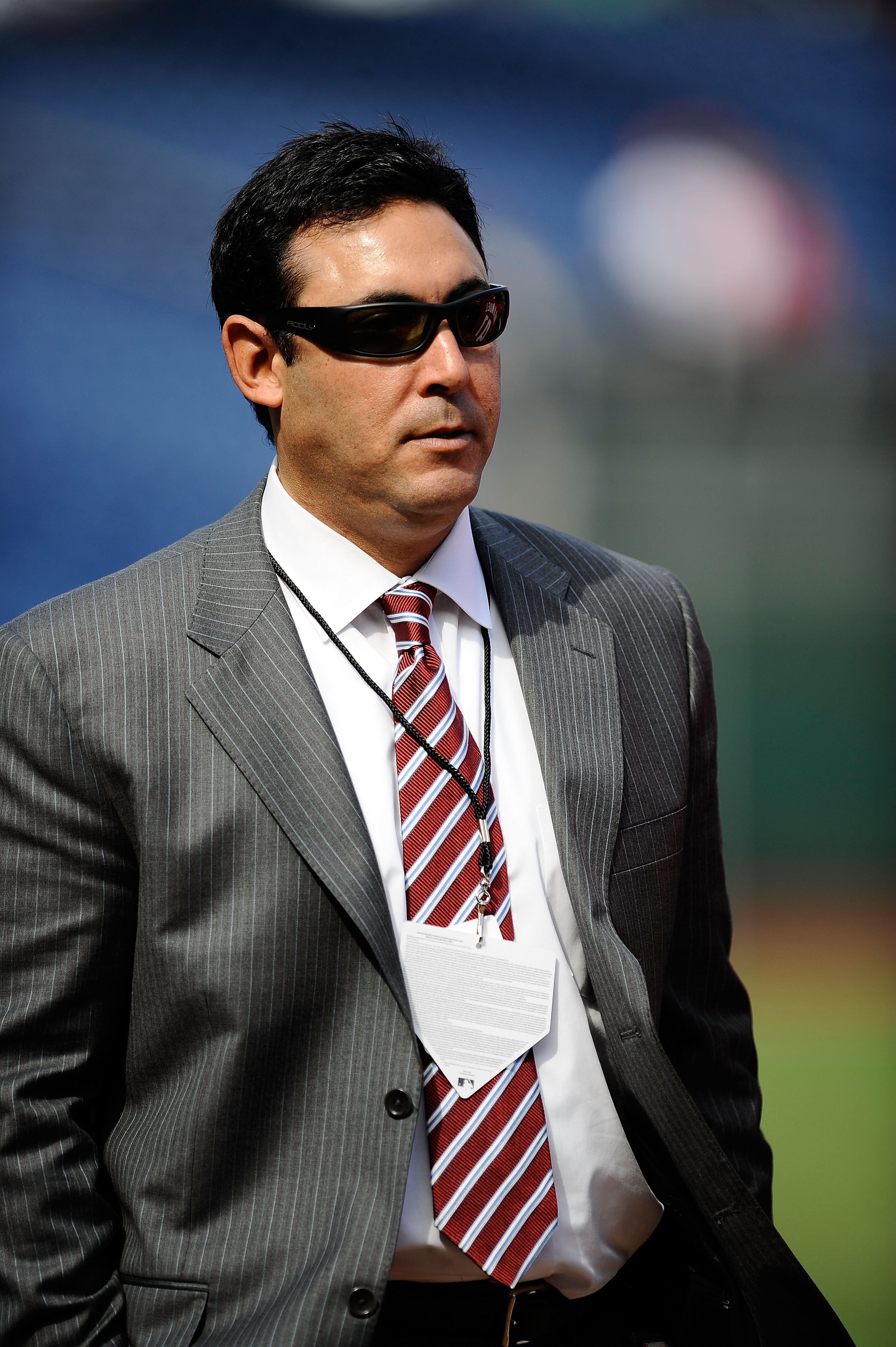 PHILADELPHIA - OCTOBER 08:  General Manager Ruben Amaro Jr. of the Philadelphia Phillies stands on the field during batting practice prior to Game Two of the NLDS against the Colorado Rockies during the 2009 MLB Playoffs at Citizens Bank Park on October 8