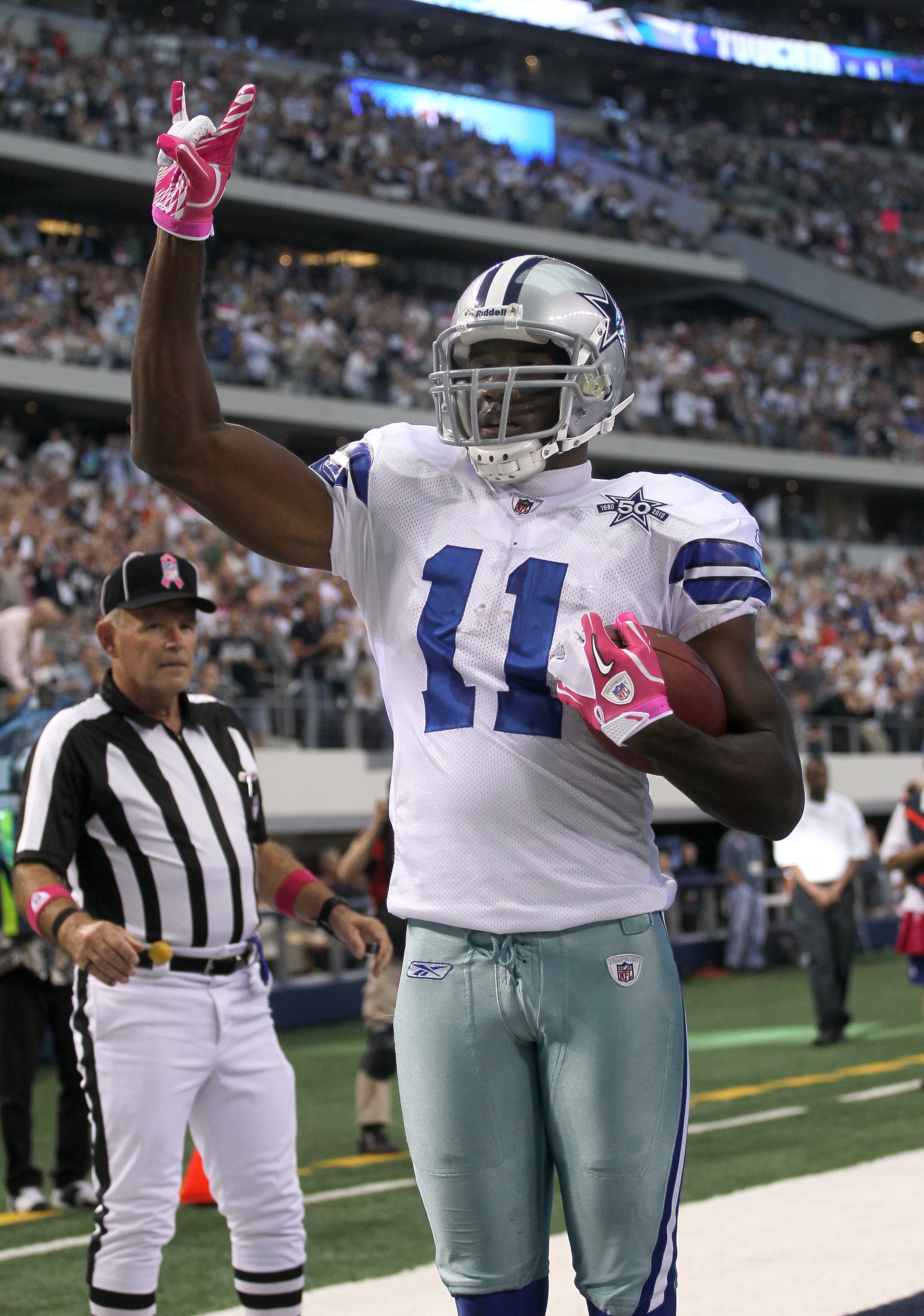ARLINGTON, TX - OCTOBER 10:  Wide receiver Roy Williams #11 of the Dallas Cowboys celebrates after making a six yard touchdown reception in the second quarter against the Tennessee Titans at Cowboys Stadium on October 10, 2010 in Arlington, Texas.  (Photo