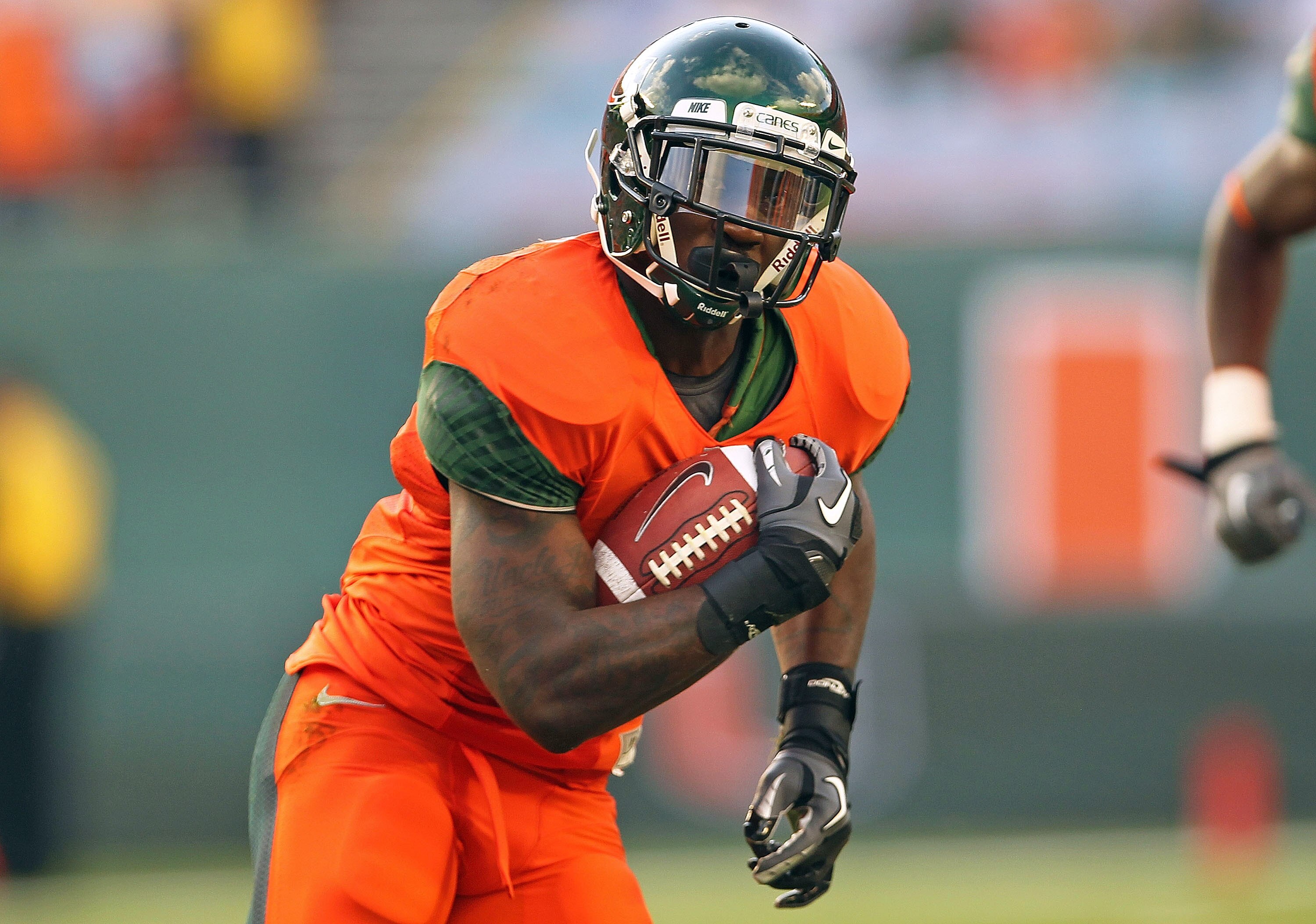 MIAMI - NOVEMBER 20: Aldarius Johnson #4 of the Miami Hurricanes rushes during a game against the Virginia Tech Hokies at Sun Life Stadium on November 20, 2010 in Miami, Florida.  (Photo by Mike Ehrmann/Getty Images)