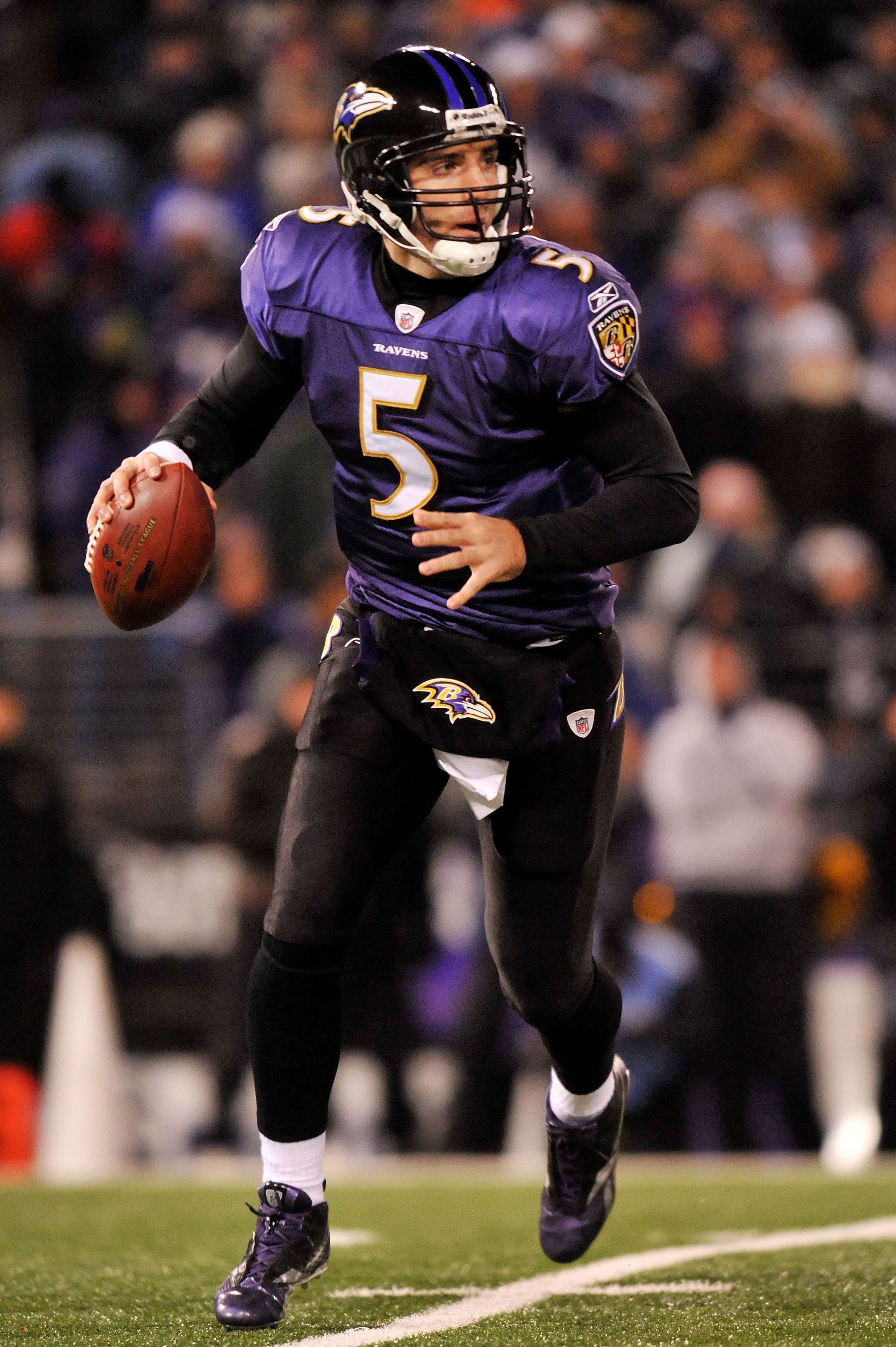 BALTIMORE, MD - DECEMBER 05:  Quarterback Joe Flacco #5 of the Baltimore Ravens looks to pass against the Pittsburgh Steelers during the first half of the game at M&T Bank Stadium on December 5, 2010 in Baltimore, Maryland.  (Photo by Larry French/Getty I