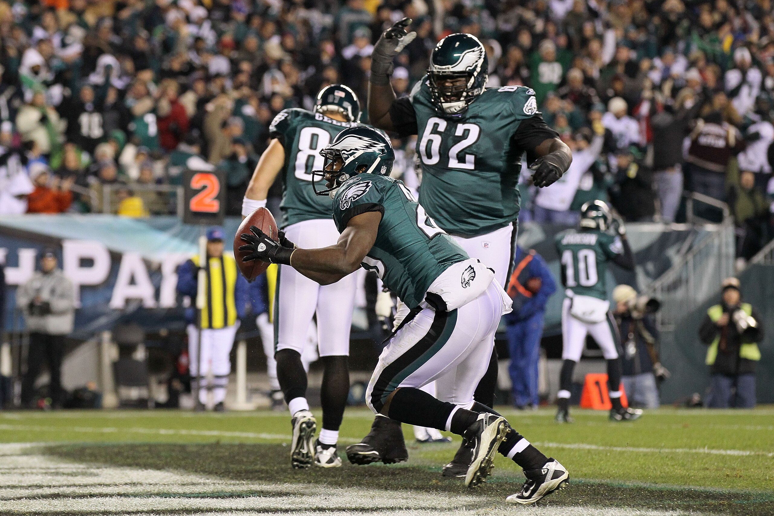 PHILADELPHIA, PA - DECEMBER 02: Lesean Mccoy #25 and Antoine Caldwell #62 of the Philadelphia celebrate after Mccoy scored a 4-yard rushing touchdown in the second quarter against the Houston Texans at Lincoln Financial Field on December 2, 2010 in Phila PHILADELPHIA, PA - DECEMBER 02: Lesean Mccoy #25 and Antoine Caldwell #62 of the Philadelphia celebrate after Mccoy scored a 4-yard rushing touchdown in the second quarter against the Houston Texans at Lincoln Financial Field on December 2, 2010 in Phila