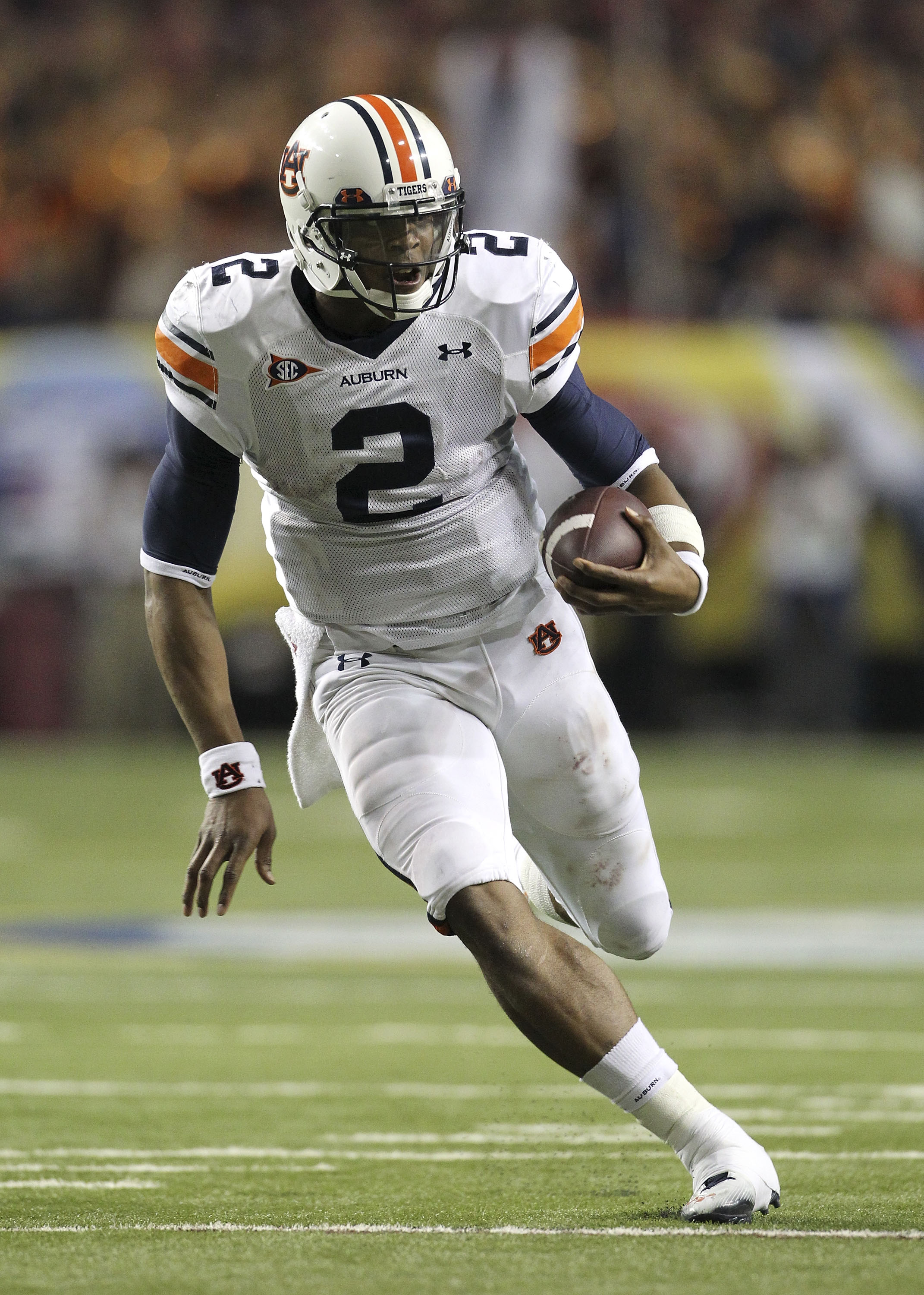 ATLANTA - DECEMBER 4:  Quarterback Cam Newton #2 of the Auburn Tigers runs with the ball during the 2010 SEC Championship against the South Carolina Gamecocks at Georgia Dome on December 4, 2010 in Atlanta, Georgia. (Photo by Mike Zarrilli/Getty Images)