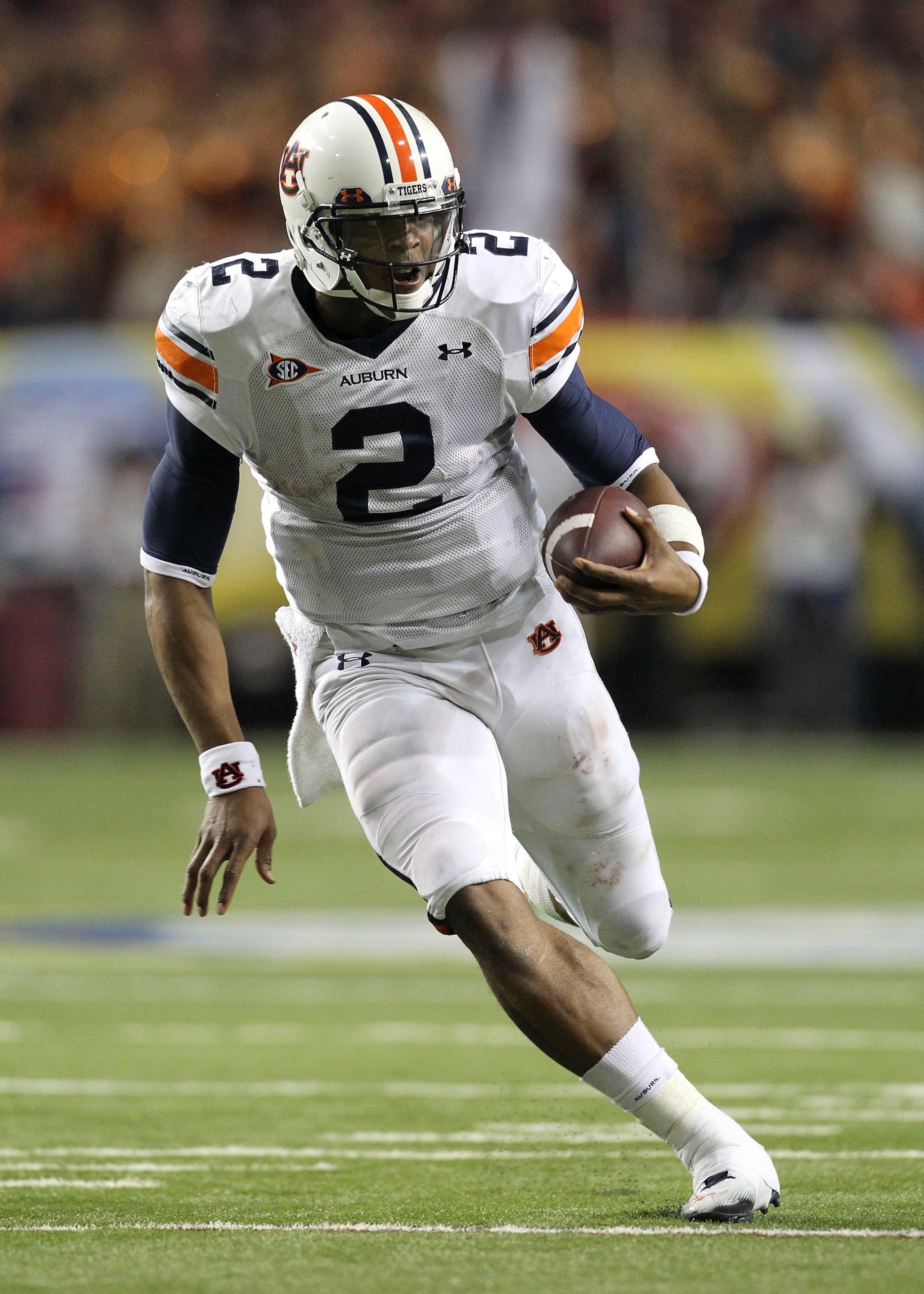 ATLANTA - DECEMBER 4: Quarterback Cam Newton #2 of the Auburn Tigers runs with the ball during the 2010 SEC Championship against the South Carolina Gamecocks at Georgia Dome on December 4, 2010 in Atlanta, Georgia. (Photo by Mike Zarrilli/Getty Images) ATLANTA - DECEMBER 4: Quarterback Cam Newton #2 of the Auburn Tigers runs with the ball during the 2010 SEC Championship against the South Carolina Gamecocks at Georgia Dome on December 4, 2010 in Atlanta, Georgia. (Photo by Mike Zarrilli/Getty Images)