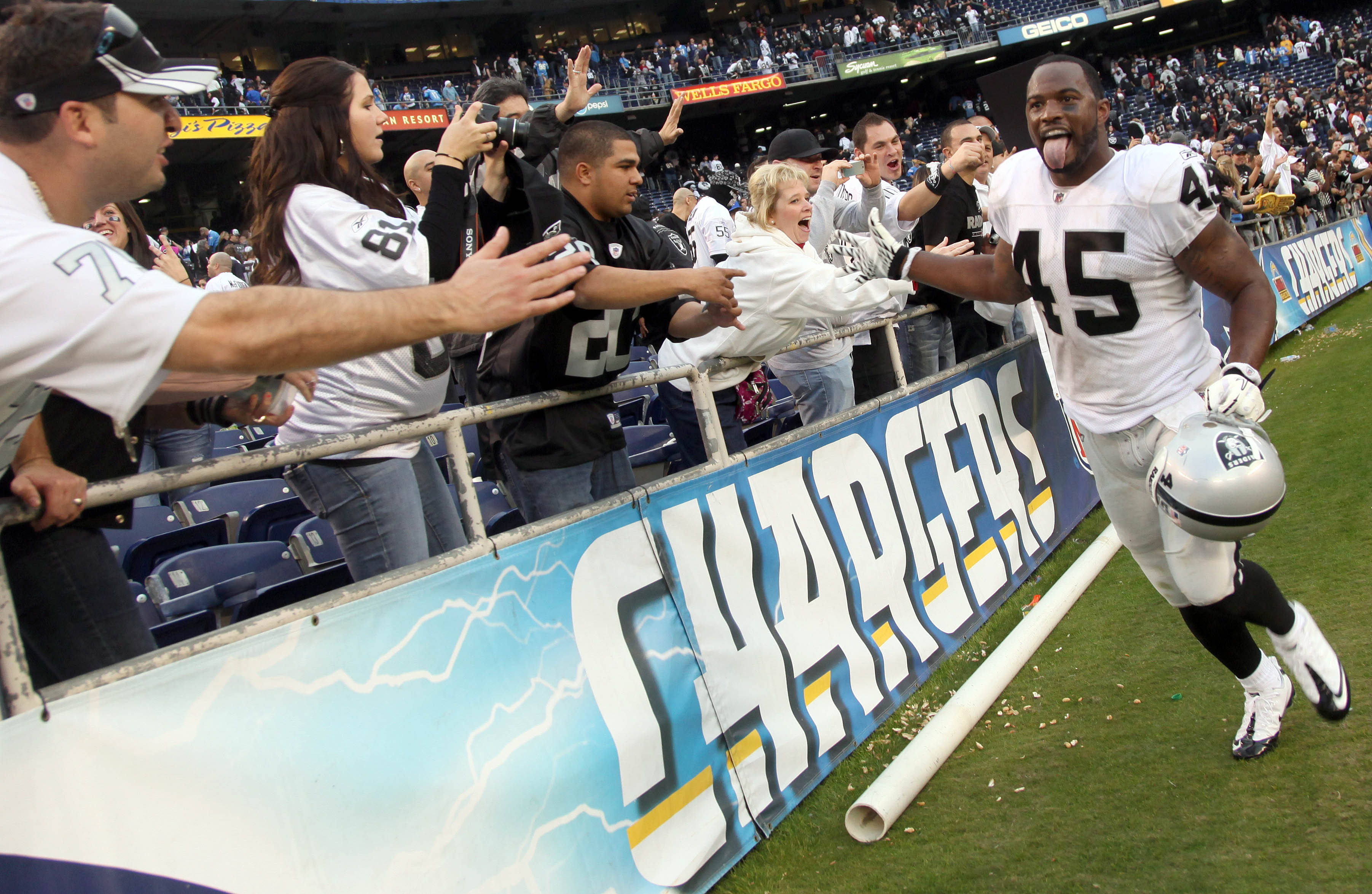 SAN DIEGO, CA - DECEMBER 5: Marcel Reece #45 of the Oakland Raiders greets fans after his team's 28-13 win over the San Diego Chargers during their NFL game at Qualcomm Stadium on December 5, 2010 in San Diego, California. (Photo by Donald Miralle/Getty I
