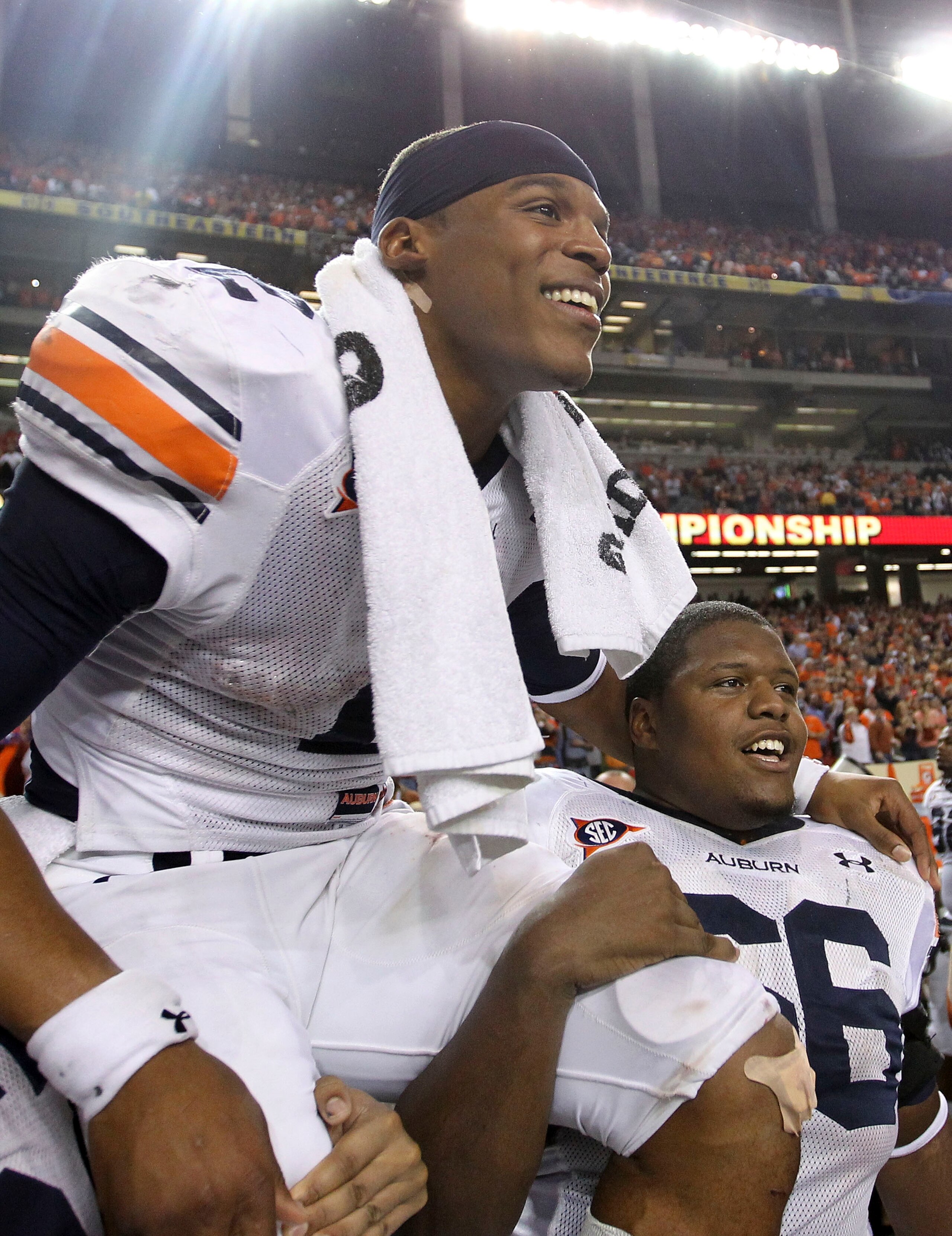 ATLANTA - DECEMBER 04: Quarterback Cam Newton #2 of the Auburn Tigers is carried on the field after the 2010 SEC Championship against the South Carolina Gamecocks at Georgia Dome on December 4, 2010 in Atlanta, Georgia. The Tigers beat the Gamecocks 56- ATLANTA - DECEMBER 04: Quarterback Cam Newton #2 of the Auburn Tigers is carried on the field after the 2010 SEC Championship against the South Carolina Gamecocks at Georgia Dome on December 4, 2010 in Atlanta, Georgia. The Tigers beat the Gamecocks 56-
