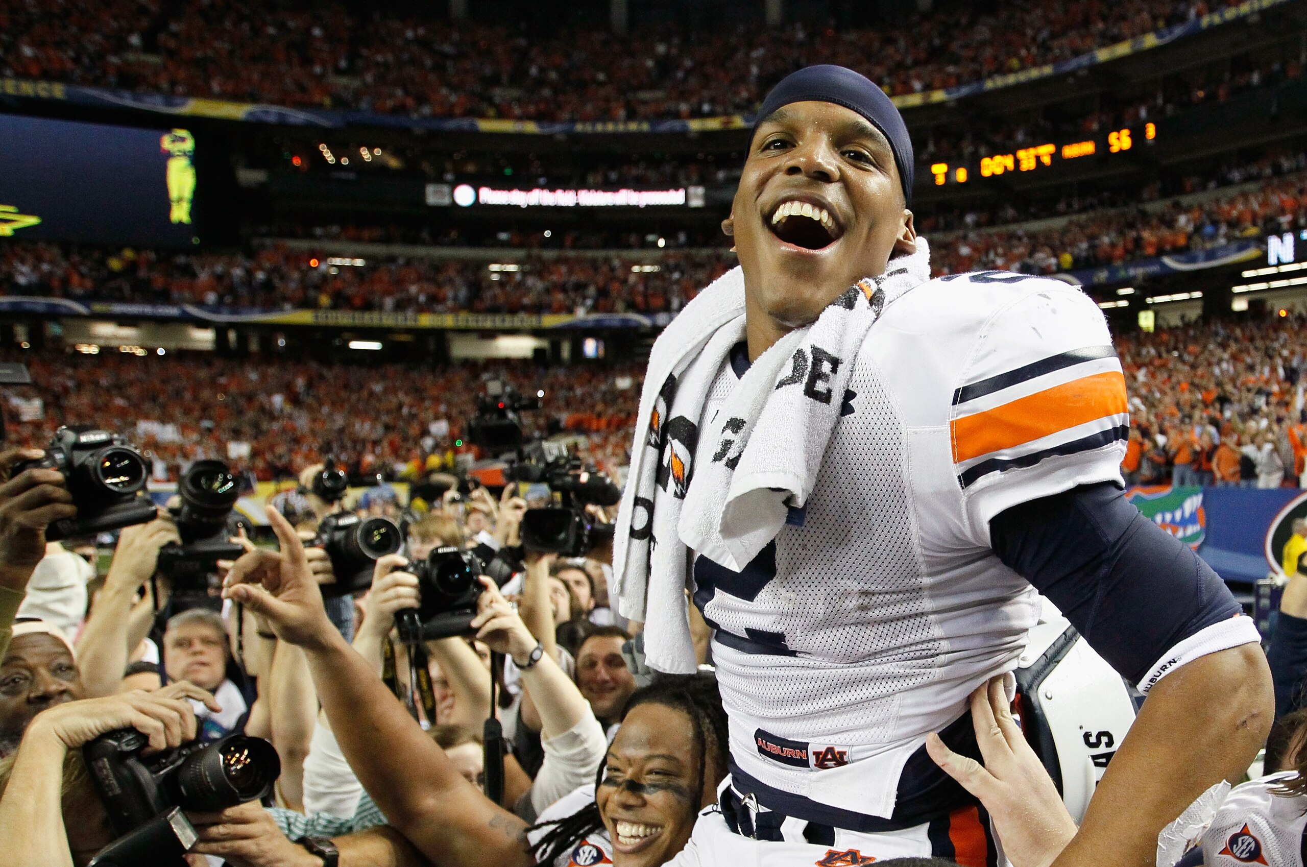 ATLANTA, GA - DECEMBER 04: Quarterback Cam Newton #2 of the Auburn Tigers celebrates after their 56-17 win over the South Carolina Gamecocks during the 2010 SEC Championship at Georgia Dome on December 4, 2010 in Atlanta, Georgia. (Photo by Kevin C. Cox ATLANTA, GA - DECEMBER 04: Quarterback Cam Newton #2 of the Auburn Tigers celebrates after their 56-17 win over the South Carolina Gamecocks during the 2010 SEC Championship at Georgia Dome on December 4, 2010 in Atlanta, Georgia. (Photo by Kevin C. Cox