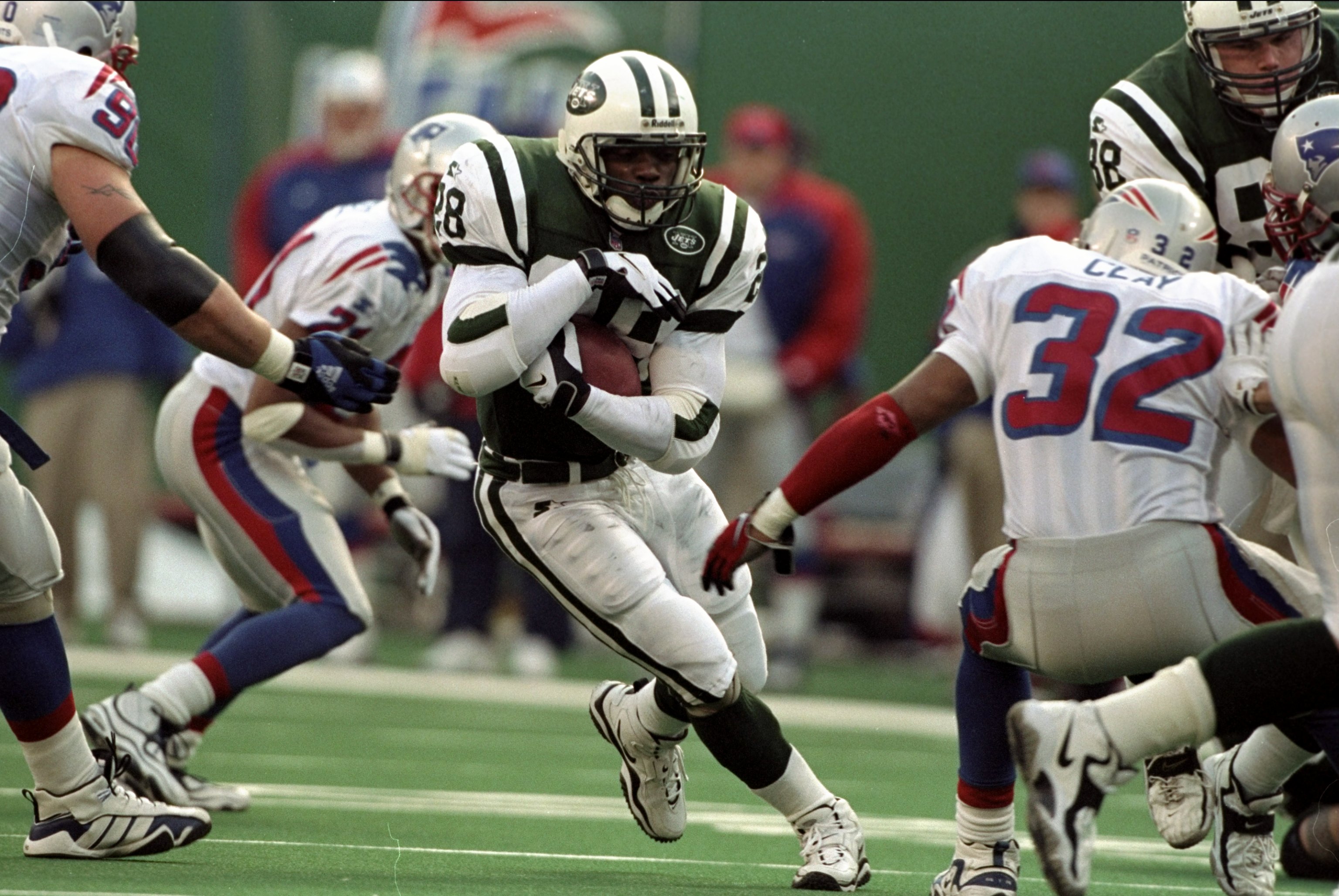 27 Dec 1998: Curtis Martin #28 of the New York Jets carries the ball during a game against the New England Patriots at Giants Stadium in East Rutherford, New Jersey. The Jets defeated the Patriots 31-10.