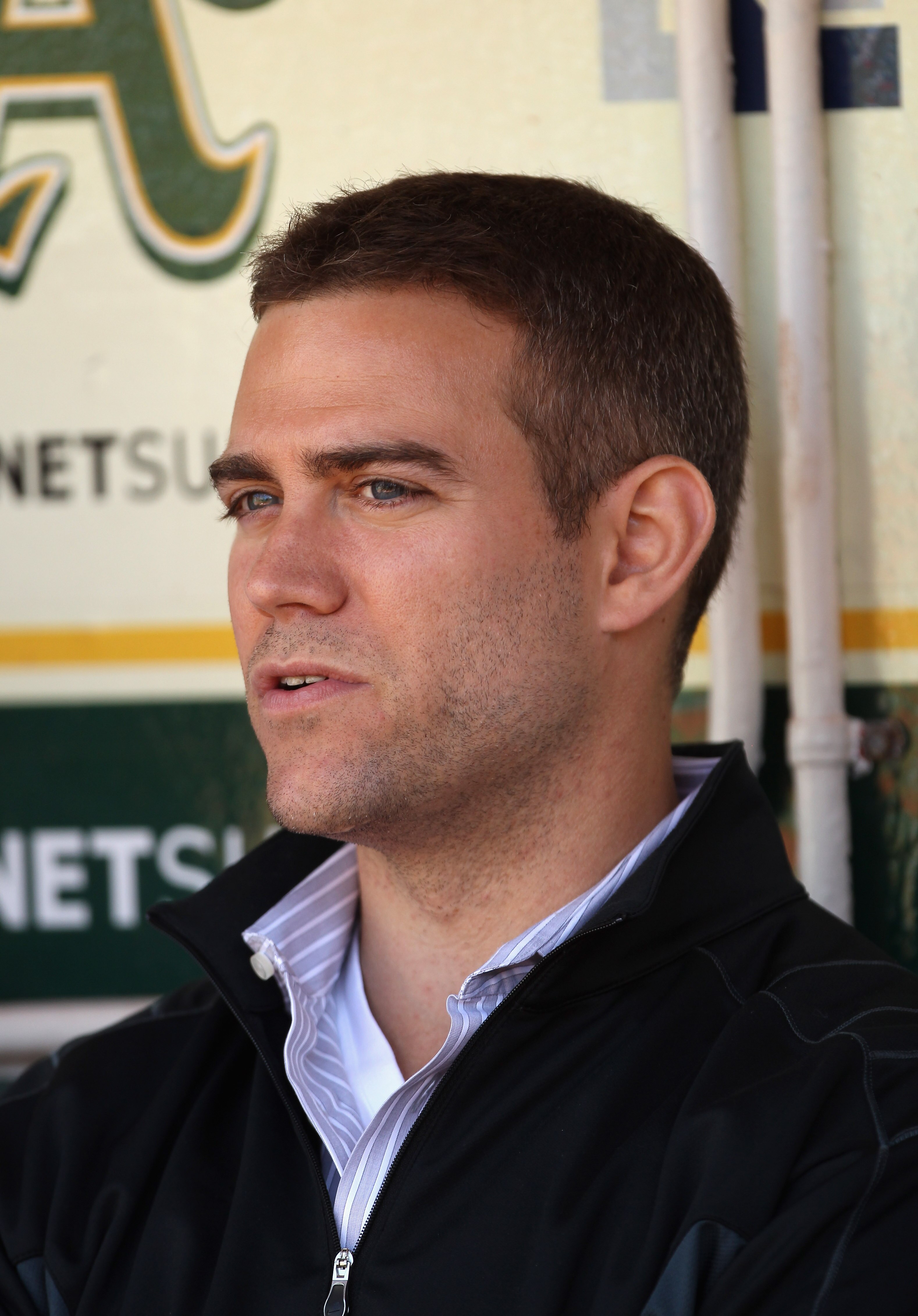 OAKLAND, CA - JULY 19:  Boston Red Sox general manager Theo Epstein sits in the dugout before their game against the Oakland Athletics at the Oakland-Alameda County Coliseum  on July 19, 2010 in Oakland, California.  (Photo by Ezra Shaw/Getty Images)
