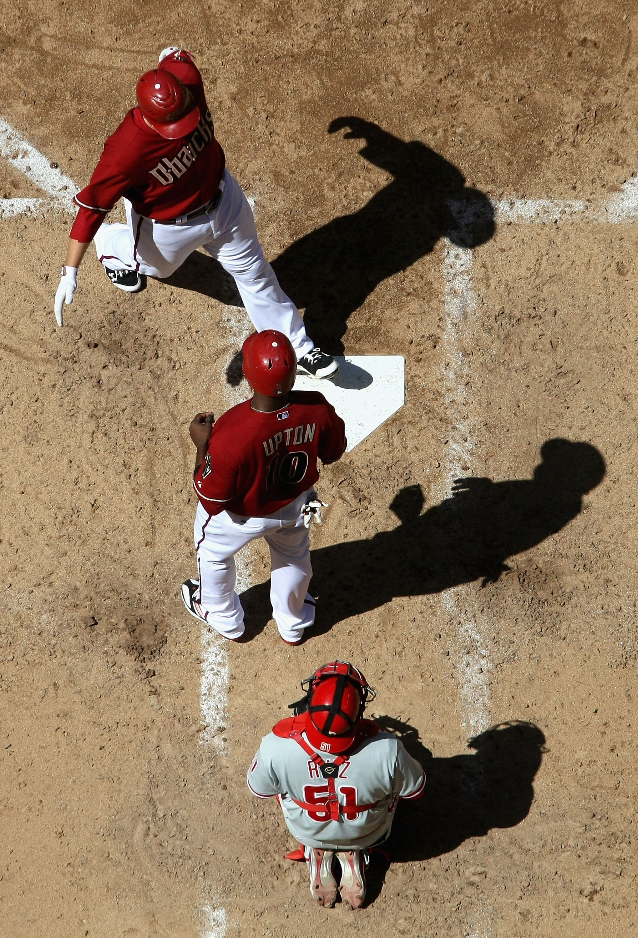 PHOENIX - APRIL 25:  Mark Reynolds #27 of the Arizona Diamondbacks is congratulated by teammate Justin Upton #10 after Reynolds hit a 3 run home run against the Philadelphia Phillies during the fifth inning of the Major League Baseball game at Chase Field