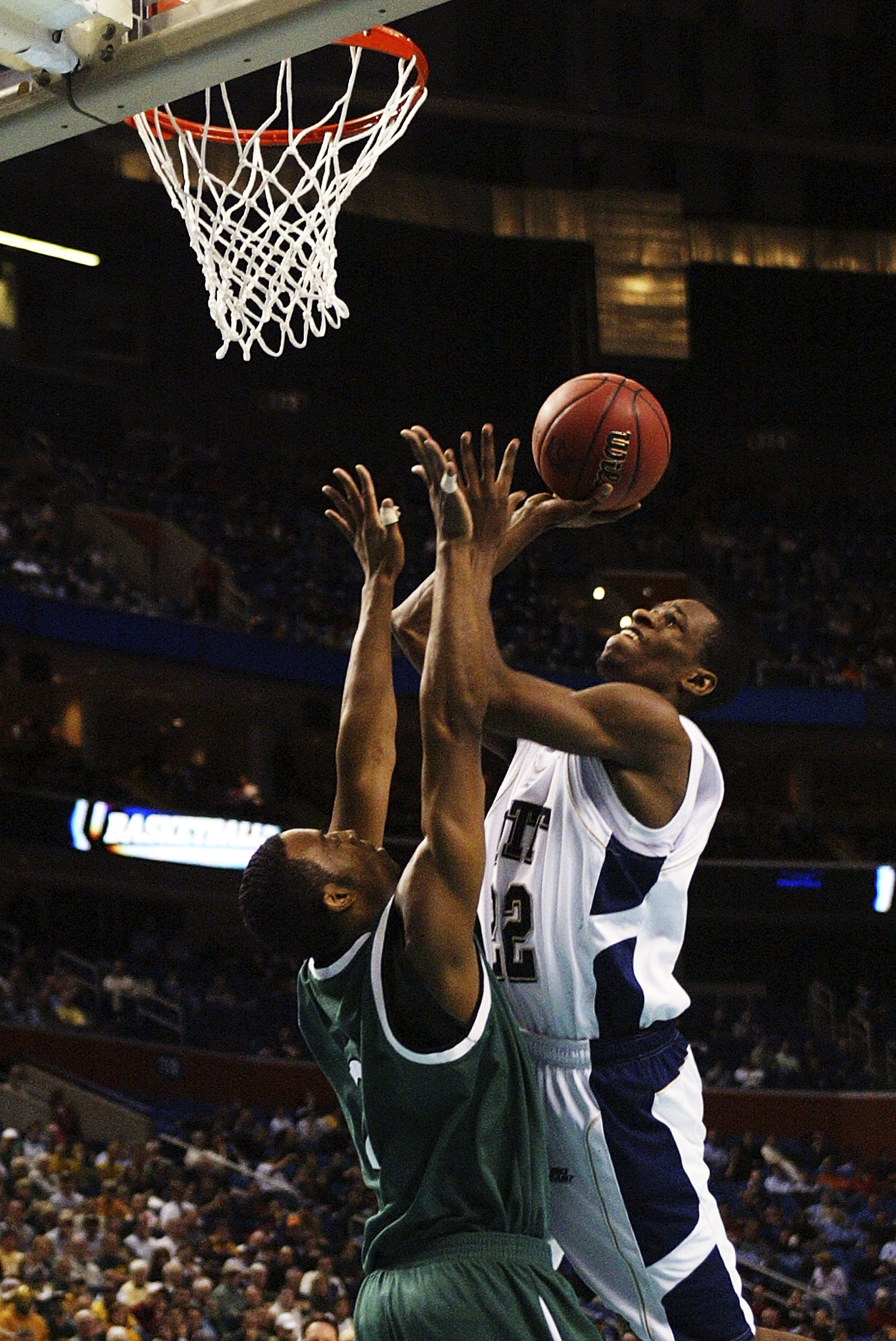BUFFALO, NY - MARCH 15:  Antonio Graves #22 of the Pittsburgh Panthers goes to the hoop against Scottie Wilson #2 of the Wright State Raiders during round one of the NCAA Men's Basketball Tournament at the HSBC Arena on March 15, 2007  in Buffalo, New Yor