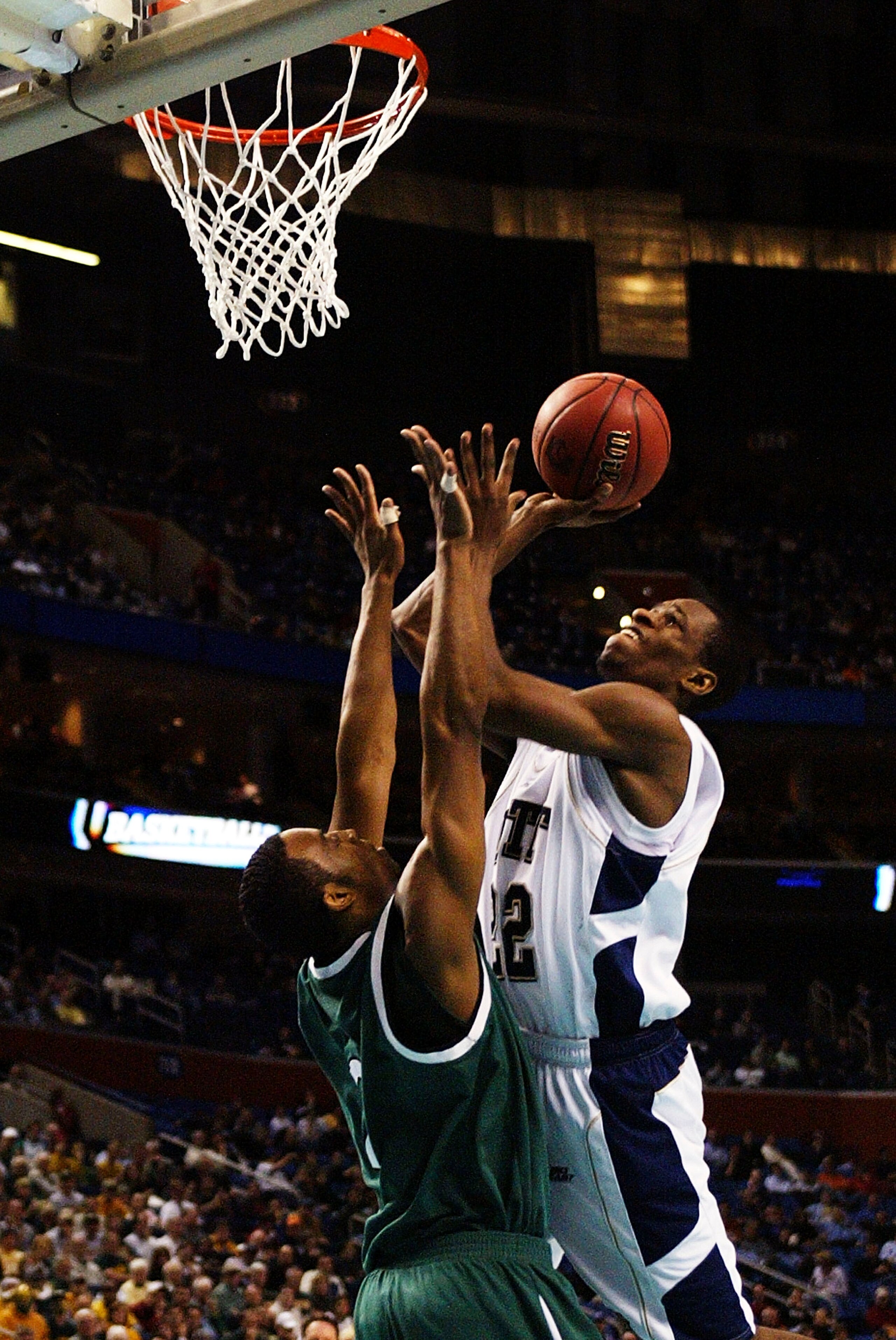 BUFFALO, NY - MARCH 15:  Antonio Graves #22 of the Pittsburgh Panthers goes to the hoop against Scottie Wilson #2 of the Wright State Raiders during round one of the NCAA Men's Basketball Tournament at the HSBC Arena on March 15, 2007  in Buffalo, New Yor