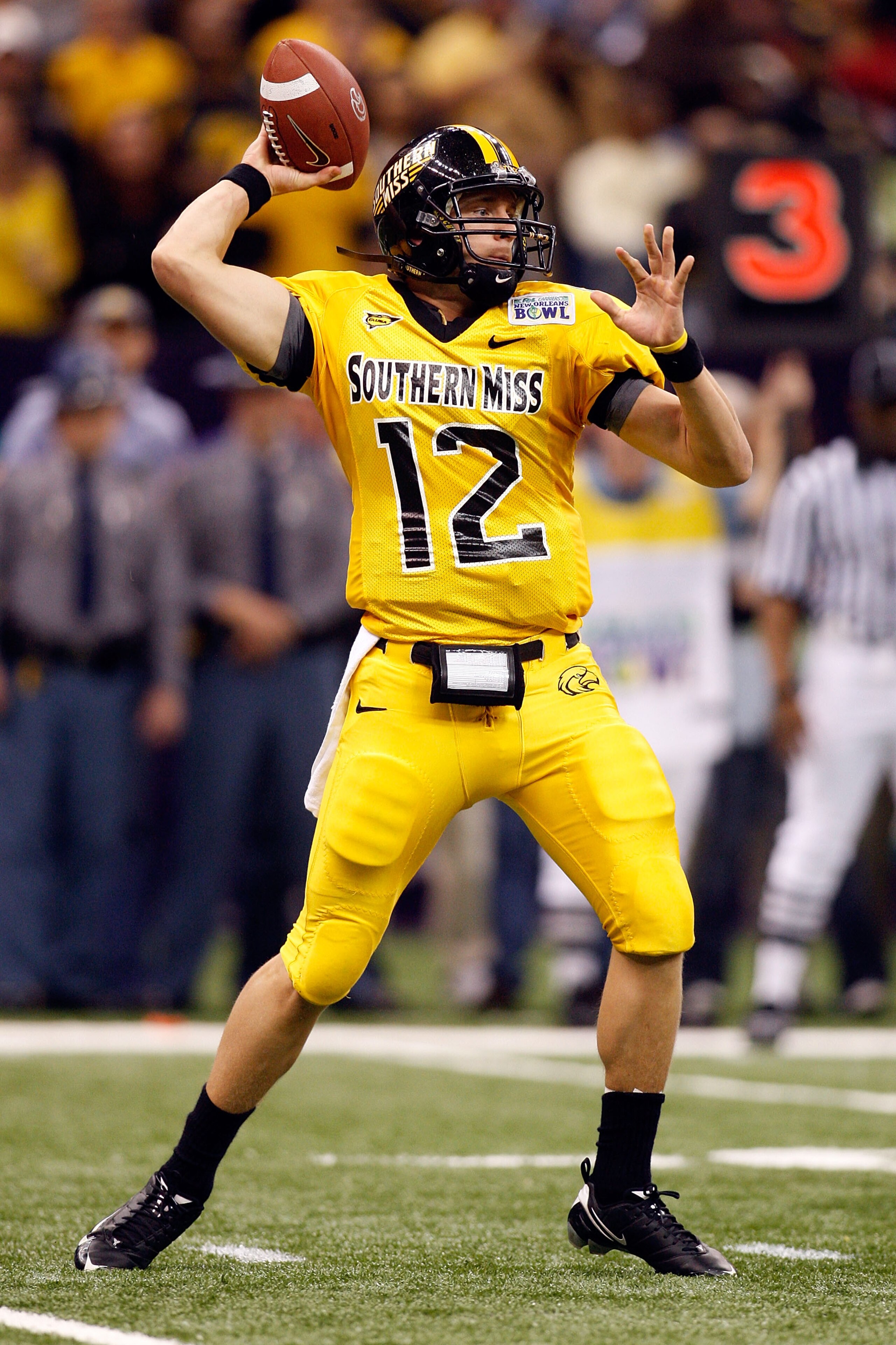 NEW ORLEANS - DECEMBER 21:  Quarterback Austin Davis #12 of the Southern Mississippi Golden Eagles looks to throw a pass against the Troy Trojans during the R+L Carriers New Orleans Bowl on December 21, 2008 at the Superdome in New Orleans, Louisiana.  (P