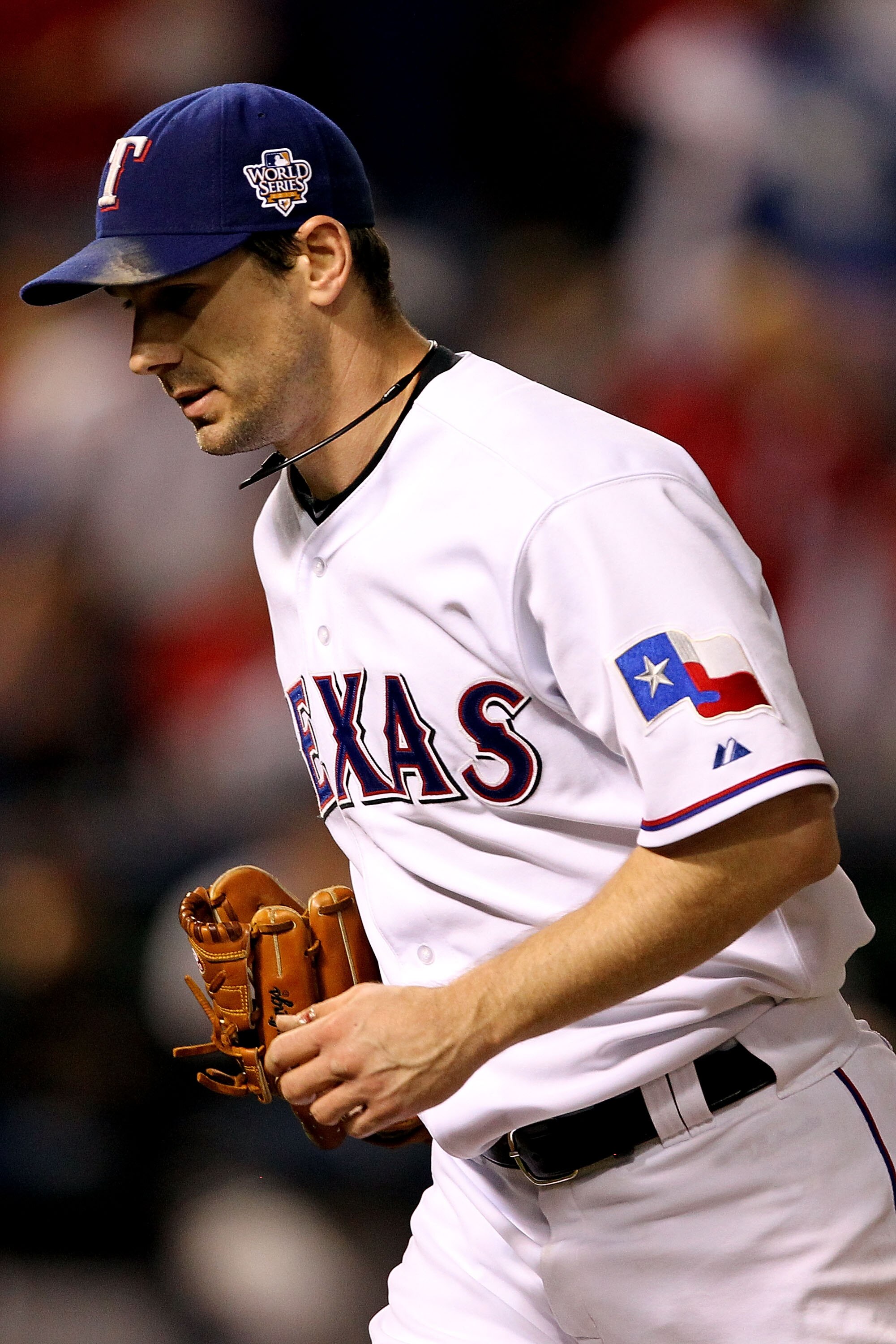 ARLINGTON, TX - NOVEMBER 01:  Cliff Lee #33 of the Texas Rangers runs back to the dugout at the end of an inning against the San Francisco Giants in Game Five of the 2010 MLB World Series at Rangers Ballpark in Arlington on November 1, 2010 in Arlington,