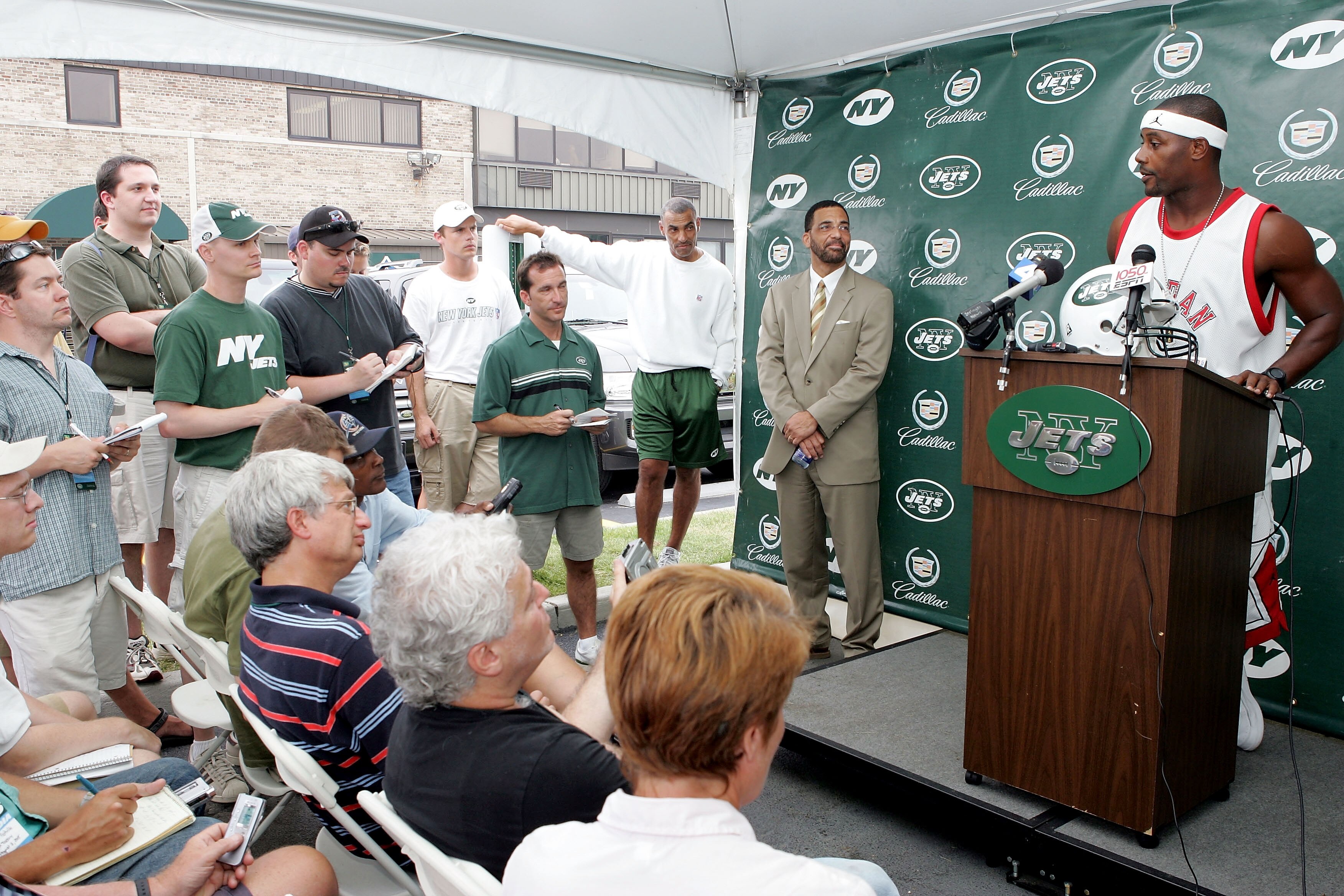 HEMPSTEAD, NY - AUGUST 8:  The newest member of the New York Jets, Ty Law, speaks to the media during a question and answer session at training camp on the Jets practice field at Hofstra University August 8, 2005 in Hempstead, New York.  (Photo by Jim McI
