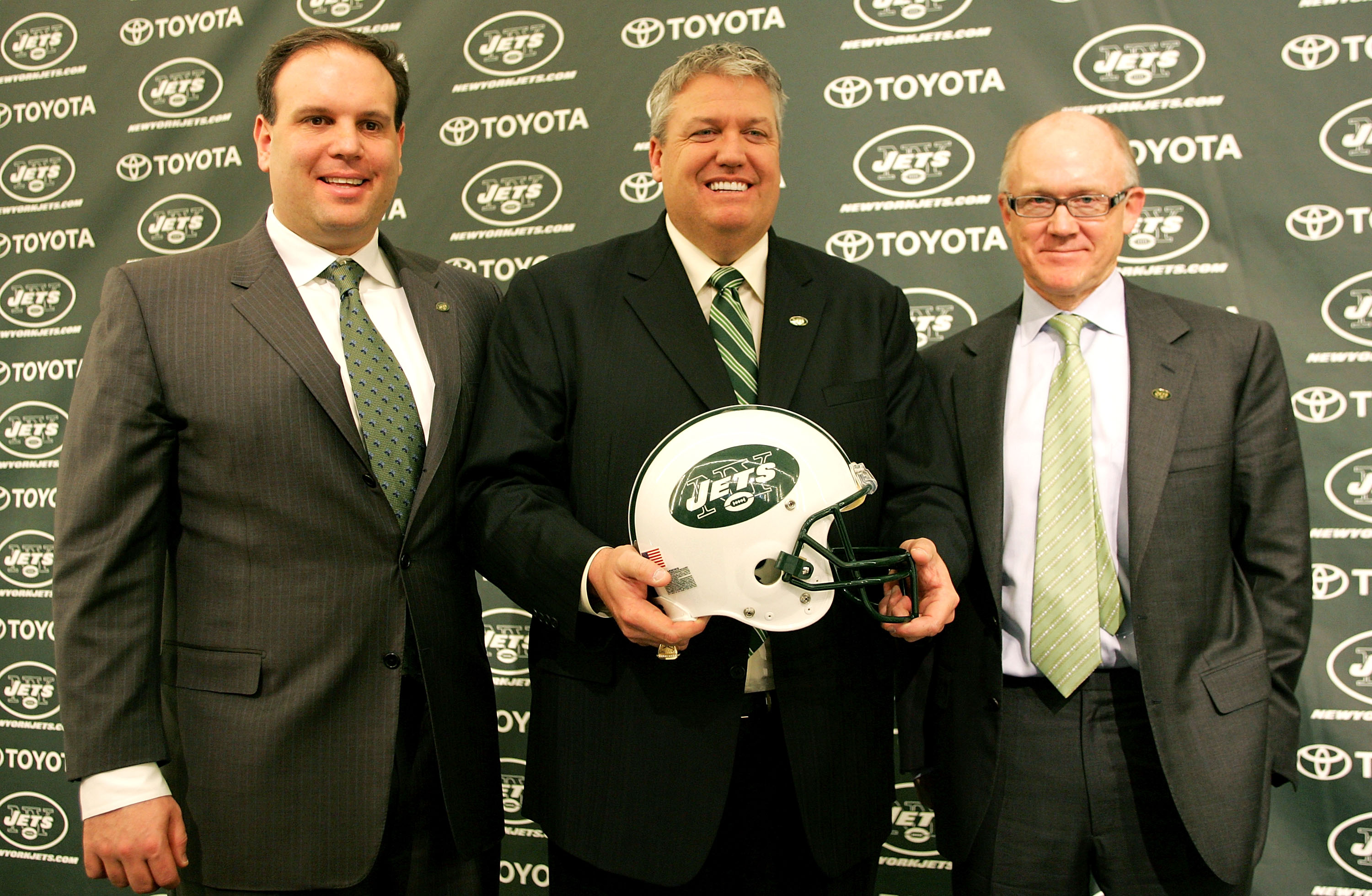 FLORHAM PARK, NJ - JANUARY 21: New York Jets Head Coach Rex Ryan (C) Owner Woody Johnson (R) and General Manager Mike Tannenbaum pose for a photo at a press conference naming Ryan as the new Head Coach of the New York Jets at the Atlantic Health Jets Trai