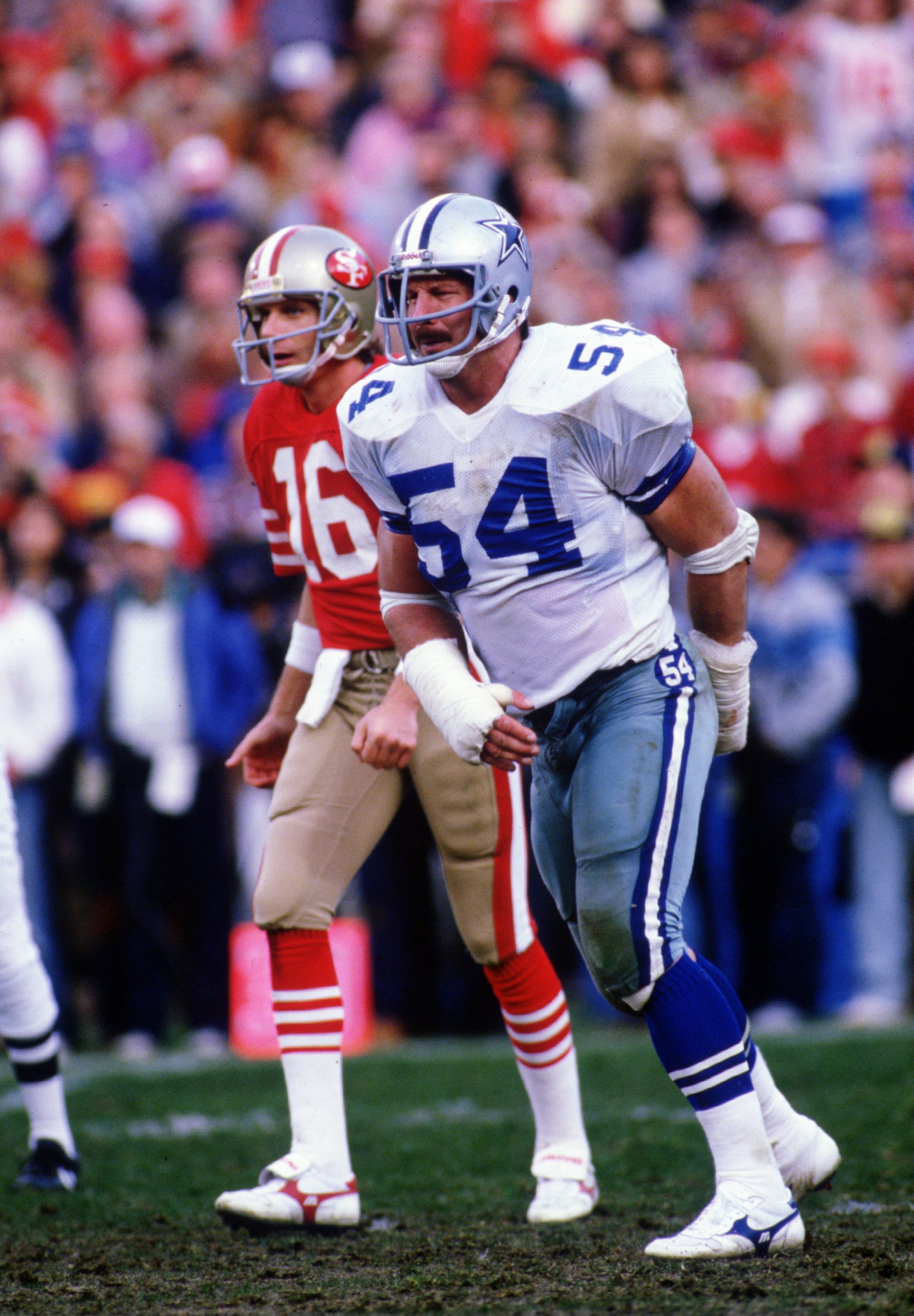 Randy White #54 of the Dallas Cowboys waits for action during a 1985 game against the San Francisco 49ers.